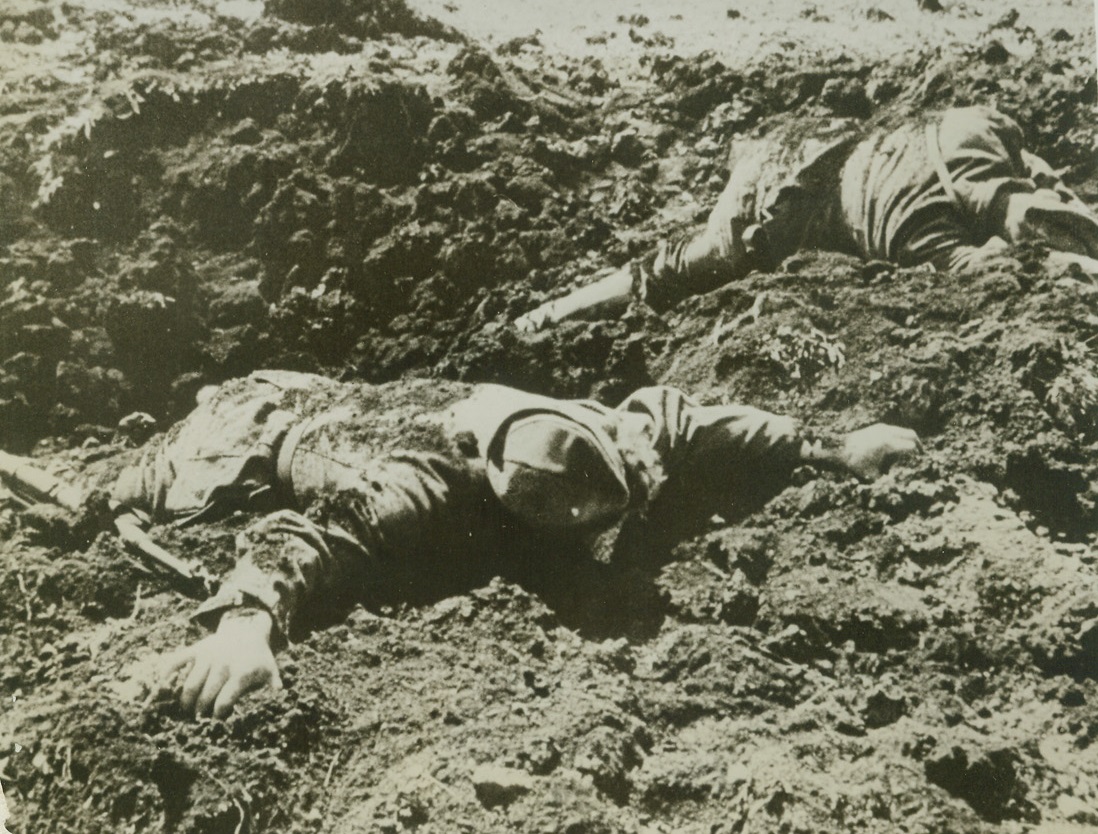 They Lie Where They Fell, 3/5/1943. Flash from “one day of war”.  This photo is from the march of time’s “One Day of War”, a documentary film of one day on the far-flung Russian front, recorded by soldier-photographers of the Red Army.  Of the 160 photographers assigned to the job, thirty were dead before the day ended. Photo shows: Dead Germans lie, face down, on the churned-up earth, where they fell when Soviet artillery and machine gun fire mowed them down.  Hundreds of thousands of Nazis littered the streets like this as the Russians pushed through Stalingrad, Rostov, Kharkov and Kursk. Credit line (March of Time “One Day of War” photo from ACME);