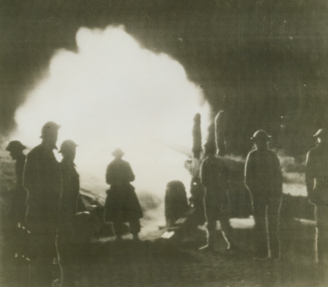 Bombarding the Mareth Line, 3/25/1943. Tunisia – This is the first photos showing action on the Mareth Line, where the British eight Army is blasting away at Rommel’s toughest defense.  Photo shows British medium guns (4.5 inch) roaring in the night during a bombardment of the Mareth line. Credit line (ACME radio photo);