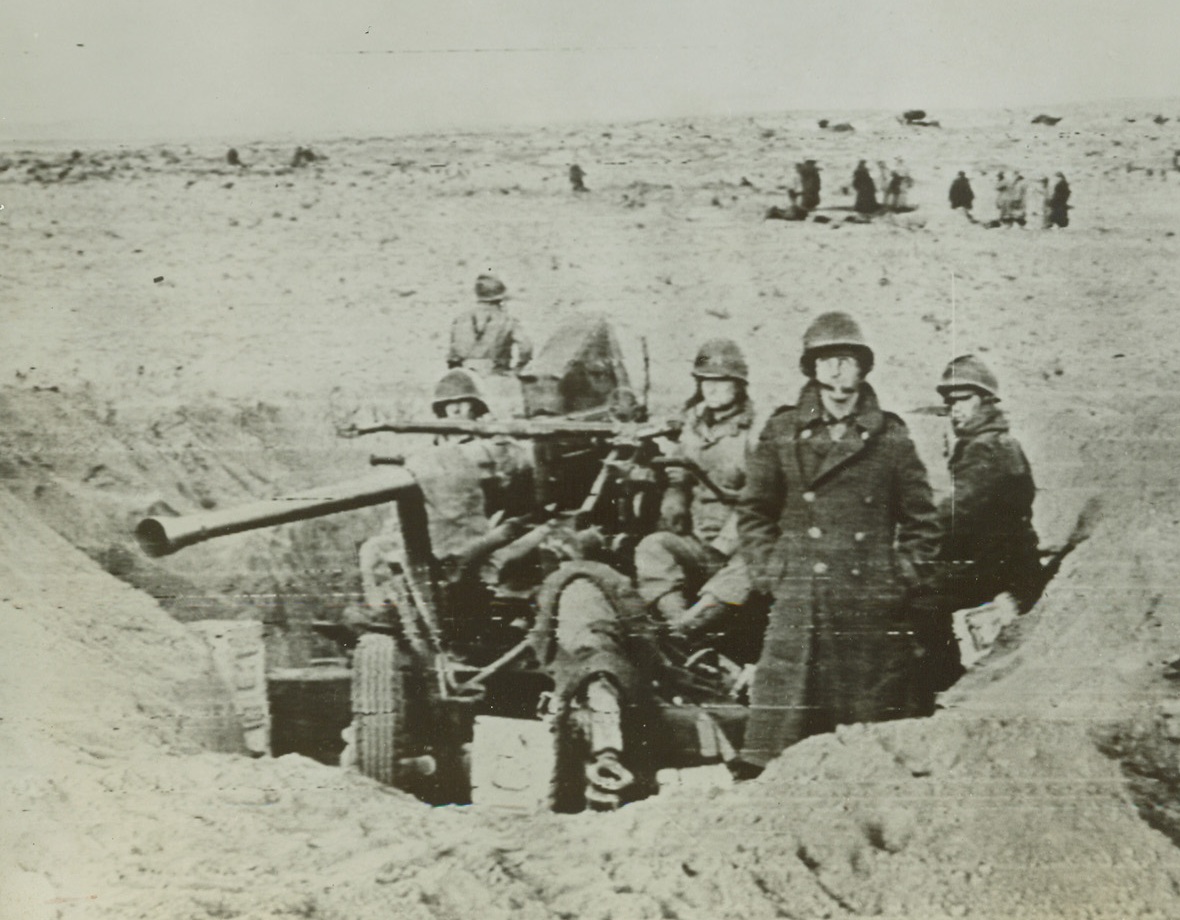 New Radio Telephoto Service Opens, 3/22/1943. Washington, D.C. – This photo, taken during the allied victory at Gafsa, on the North African front, has just been received over the newly established Signal Corps radio telephoto.  The new service links directly the War department in Washington, with the headquarters of Gen. Dwight D. Eisenhower in Algiers, for two-way radio transmission.  This photo, taken at the front and flown to Algiers, was transmitted in seven minutes.  The picture shows a gun crew that has dug in and is on the alert. Credit line (U.S. Army Signal Corps);