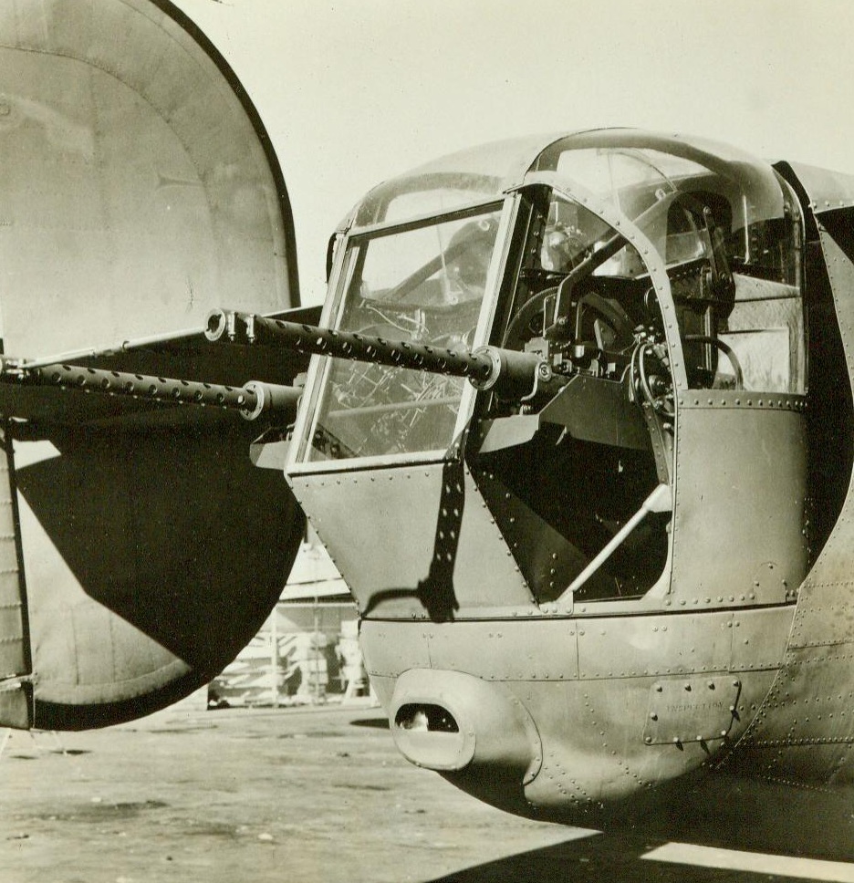 Stingers, 3/15/1943. San Diego, Calif. – Mounted in a moveable powered turret, .50 caliber machine guns are ready to sing hyms of death from the tail of a giant consolidated liberator B-24 bomber. They are the tools of war of little fellows, for no fighter heavier than 160 pounds or taller than five-feet-ten can squeeze his bulk into the gunner’s compartment. The unfriendly, modern weapons swing up and down as well as sideways, to catch the enemy at a variety of attacking positions. 3/15/43 (ACME);