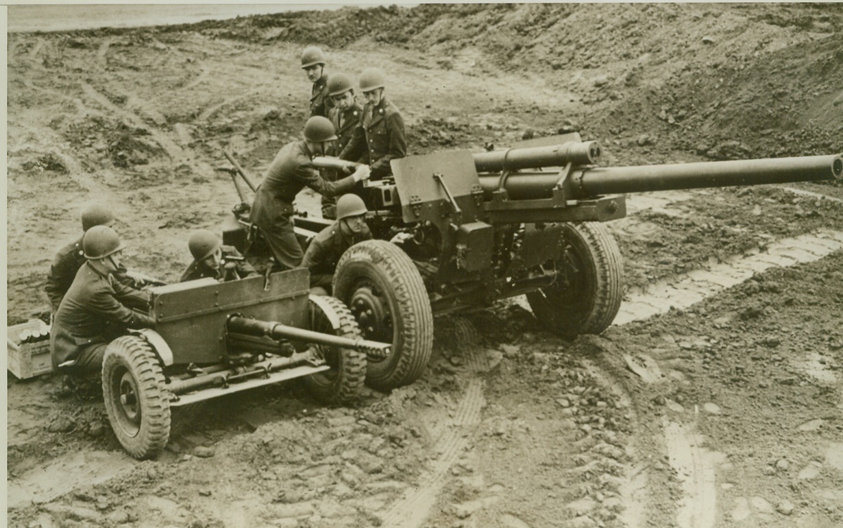 Death to Enemy Armored Forces, 3/1/1943. Aberdeen, MD.—These two U.S. Army anti-tank guns, shown at the proving ground of the Army Ordinance Department at Aberdeen are guaranteed to make it plenty tough for enemy tank and armored cars, the three-inch, high-velocity gun, (at right), can knock out even the heaviest of tanks with one shell at long range. At the left is the 37 mm weapon, using canister shot as an anti-personnel gun, was extremely effective against the Japs. The three-inch gun has been found superior to the German 88-mm cannon, in actual firing tests with armor plate targets. Credit: U.S. Army photo from ACME.;