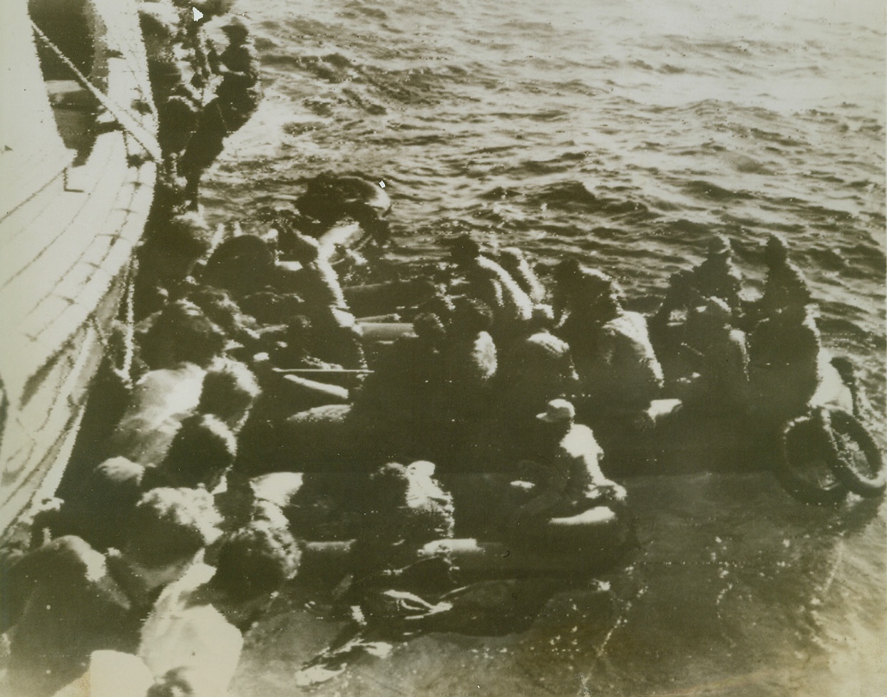 Mediterranean Round-Up, 5/20/1943. A British destroyer rounds us a load of would-be Nazi escapists 20 miles from land, midway between Tunisia and Pantelleria. Most of these Nazis are Luftwaffe anti-aircraft gunners. There would have been plenty of business for them had they escaped to the Mediterranean island, for Allied flyers are giving it a constant pounding.Credit (ACME Radiophoto);