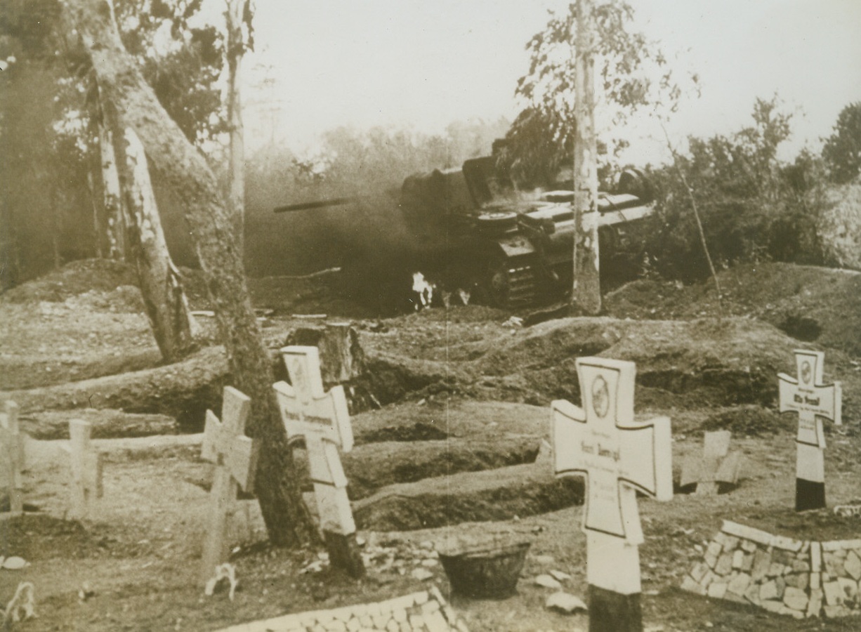 Nazi Tank In Nazi Graveyard, 5/19/1943. Tunisia: - A German tank which met a fate similar to some of the Nazi fighting men.  Artillery fire of the British knocked it out of action in the shadow of crosses over graves of Afrika Corpsmen killed in the battle of North Africa.  Action took place on the outside of Tunis. Credit Line (ACME);