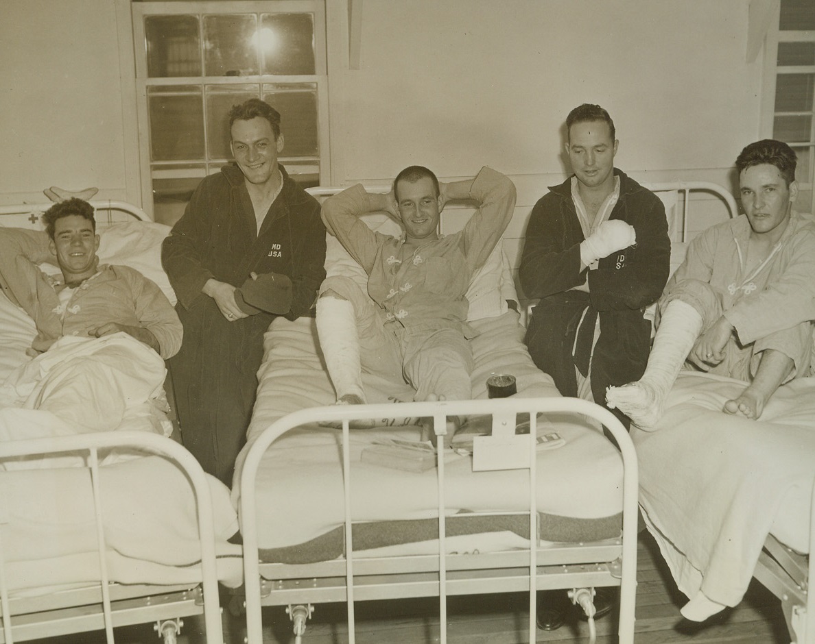 Back Ahead of Schedule, 5/30/1943, Seattle, Washington -- These boys fought on Attu, but their wounds brought them back to the states before the death knell for Jap forces there had been sounded. Recuperating at an army hospital and impatient for the day when they’ll get another crack at the Nip are: (left to right) Pvt. John E. Terknett of Eastland, Texas; Pvt. Joseph E. Kenski of Detroit, Michigan; Pvt. James A. Meredity of Springfield, Illinois; Pvt. Woodrow W. French of Greenwood, Mississippi; and Sgt. Forrest W. Johnson of Flatriver, Missouri. Passed by censor. Credit: ACME;