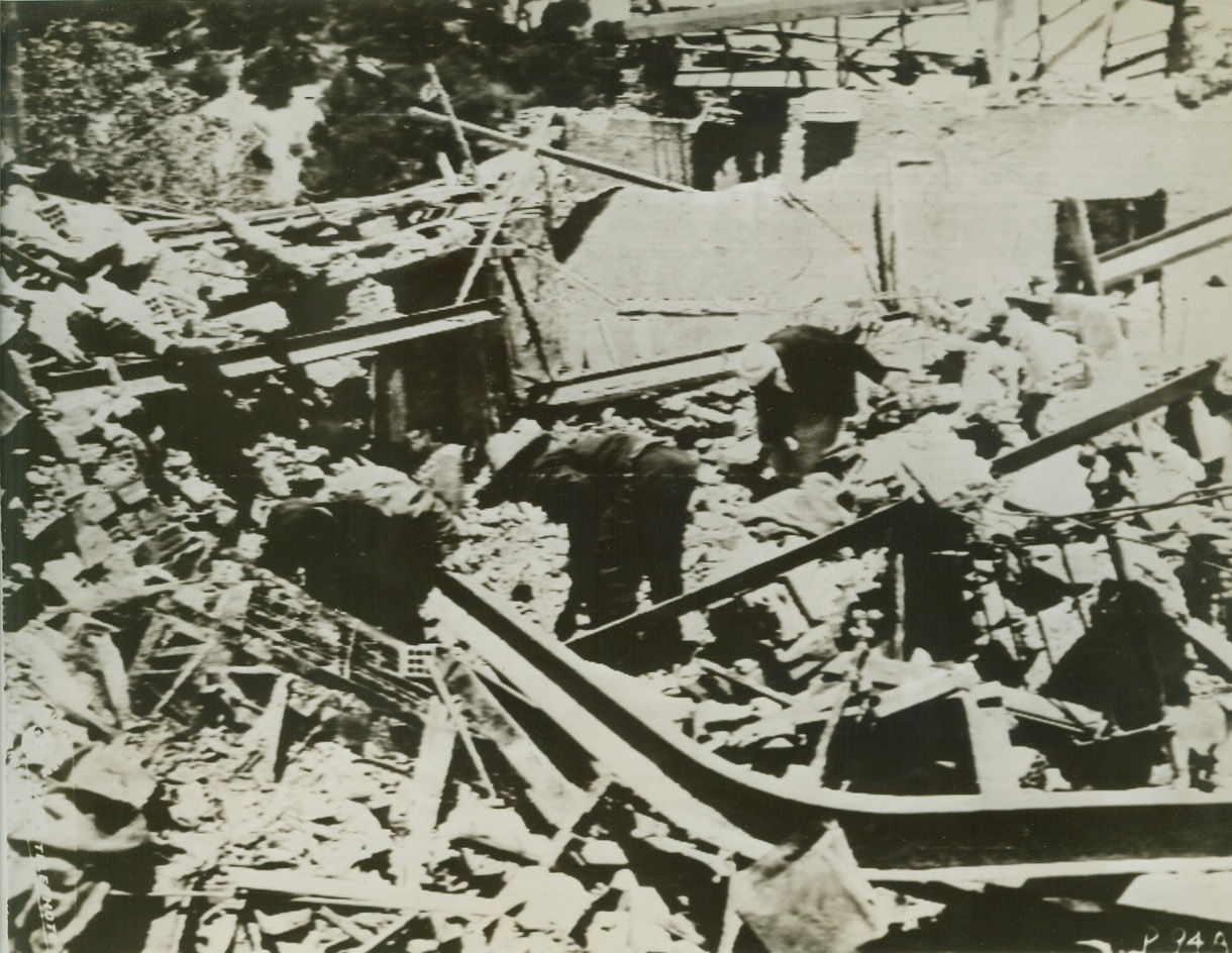 Axis Bomb Damage in Algiers, 6/7/1943. Algiers – Residents dig in the ruins of their homes, trying to salvage some few belongings after axis raiders blasted the residential area of the city, recently.Credit line (ACME photo via U.S. Signal Corps);