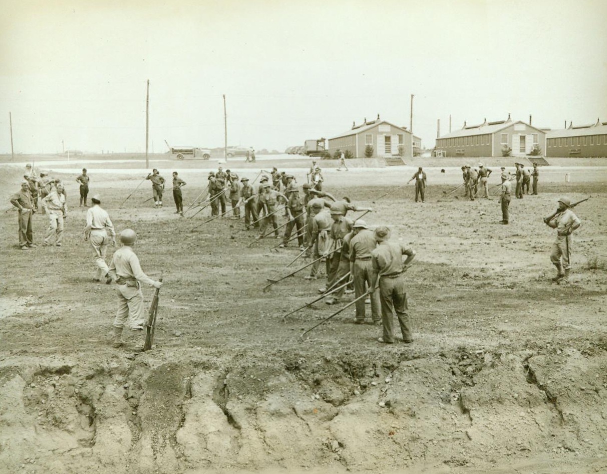 Gardening For Victory, 6/12/1943. Camp Atterbury, Ind. -- Victory gardens are no longer news, for Americans all over the country are cultivating fruits and vegetables to add to the nation's food supply -- But these victory gardeners are news! All Italian prisoners of war, they're helping wartime America on to victory by gardening in a plot outside Camp Atterbury, their internment camp. These men are some of the 14,516 Italians captured by American doughboys and brought to the U.S. for the duration 6/12/43 (ACME);