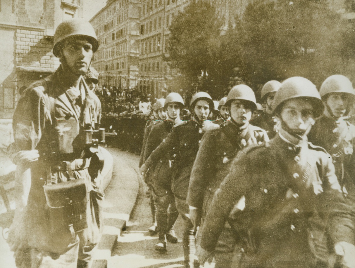 Oh, Yeah?, 8/5/1943. ROME – Nazis claim that this photo shows stalwart Italian soldiers marching through Rome, the city they will help the Germans defend against Allied assault. The statement is reminiscent of other German wishful thinking about their onetime Italian Allies. Credit Line (ACME);