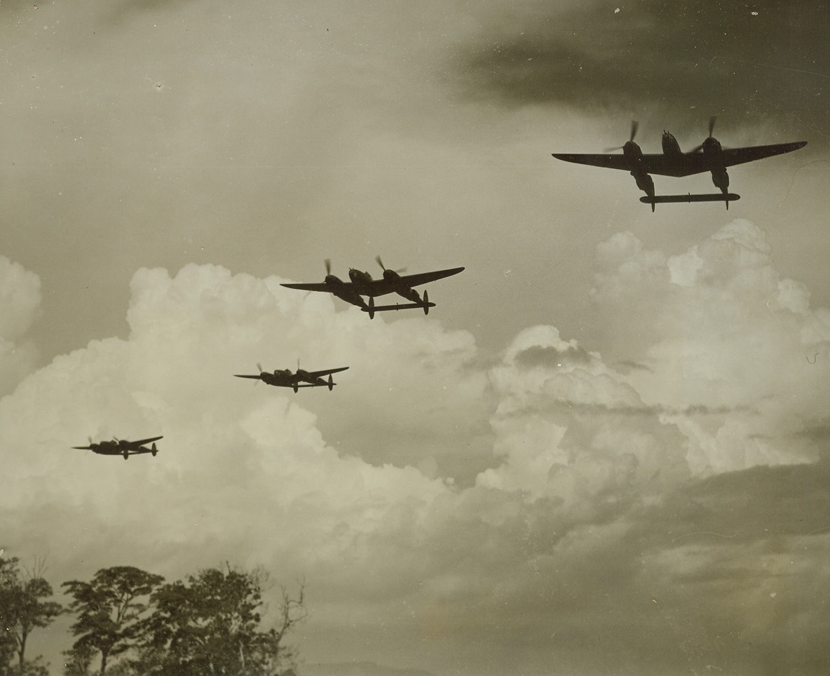 Off to Meet the Japs, 1/10/1943. Port Moresby, New Guinea – A new fighter group with their speedy P-38s is now on the job at Port Moresby. Here four of the planes, of the type which recently knocked out 77 Jap fighters in the convoy battle off Lae, speed out to smash the enemy. (Passed by Army Censor).Credit: ACME;