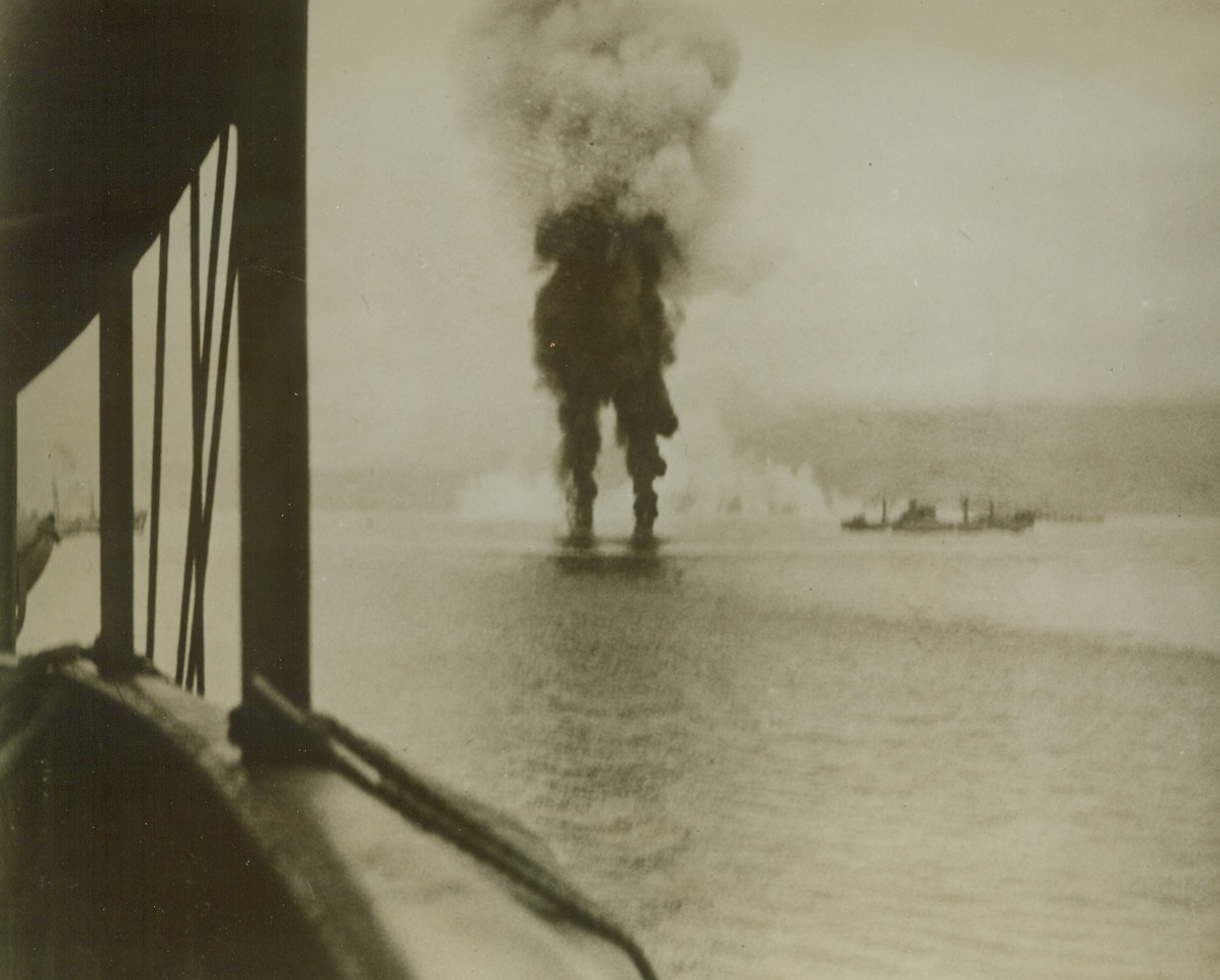 Smoke Marks the Spot, 1/14/1943. Smoke and flames mark the spot where three Japanese torpedo bombers, shot down by anti aircraft fire from American warships off Guadalcanal, last Nov. 12th, crashed to a watery grave.  The U.S. destroyer, (to right of smoke columns), helped beat off the Nip torpedo and dive bomber attack.  This phto was released by the Navy in Washington Today. Credit line (U.S. Navy photo from ACME);