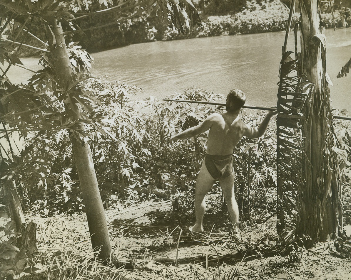 Pardon His Abbreviated Sarong, 1/16/1943. Guadalcanal – Taking advantage of a lull on Guadalcanal, this U.S. Marine went in for a bit of native style fishing.  He donned native dress and tried his luck at bagging tropical fish with a spear. Credit (US Marine Corps photo from ACME);