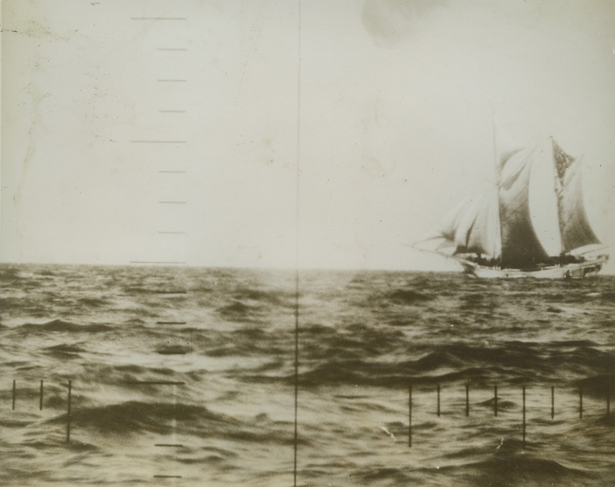 Sails and a Submarine, 1/23/1943. Only the horizontal and vertical lines disclose that this remarkably clear picture of an unidentified schooner, in enemy Pacific waters, was made throught the periscope of a U.S. submarine.  In these days of steam, such pictures of schooners under full sail are rare.  The Japanese use many sailing vessels, formerly employed in hauling copra and inter-island supplies, as patrol ships. Credit (official US Navy photo from ACME);