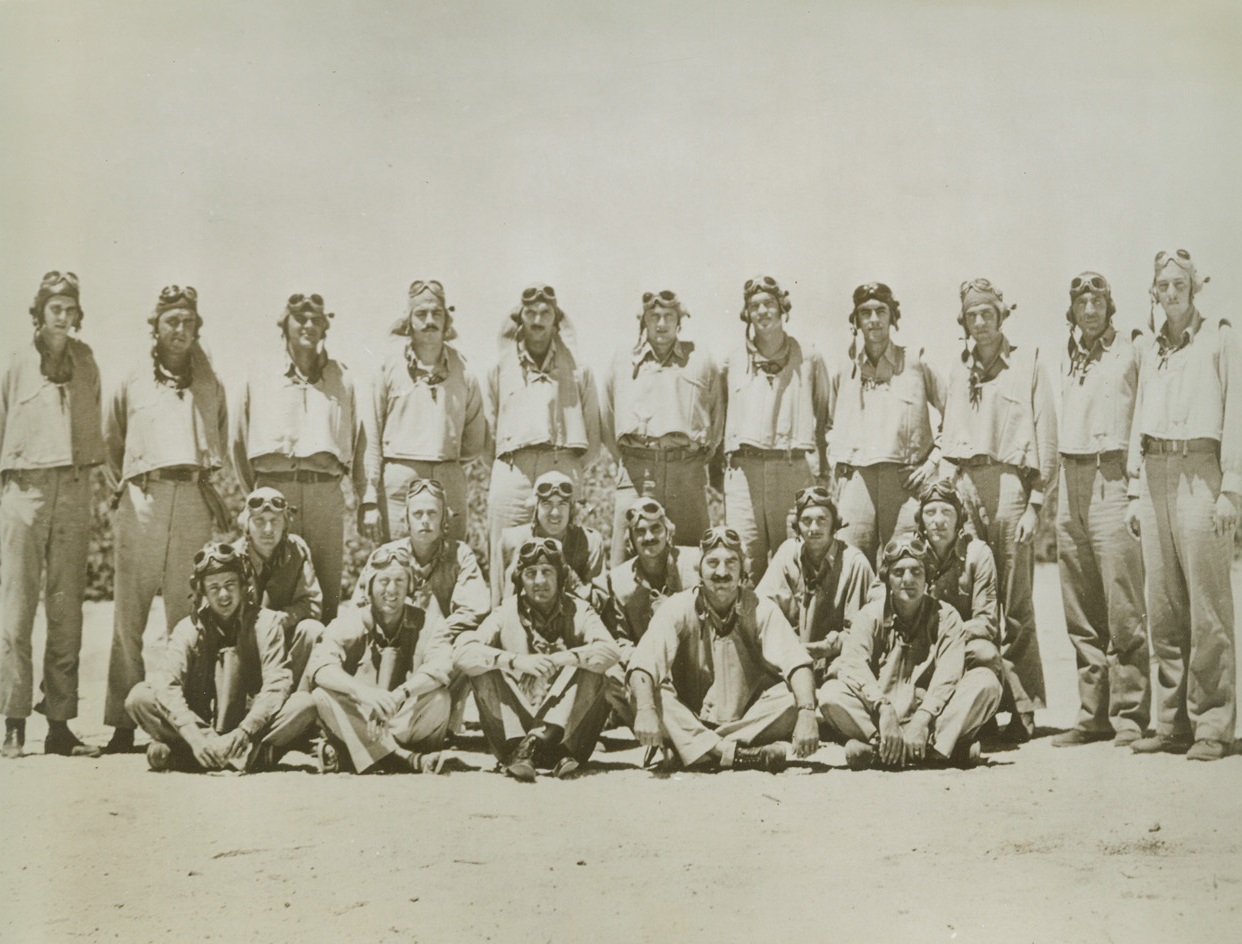Midway Bombing Squadron, 1/9/1943. Pictured here on the sands of Midway are the pilots of the Marine scout bombing squadron 241, all of whom have been decorated for their heroism in the battle of Midway.  Many are now listed as missing and presumed lost. Credit (U.S. Marine Corps photo);