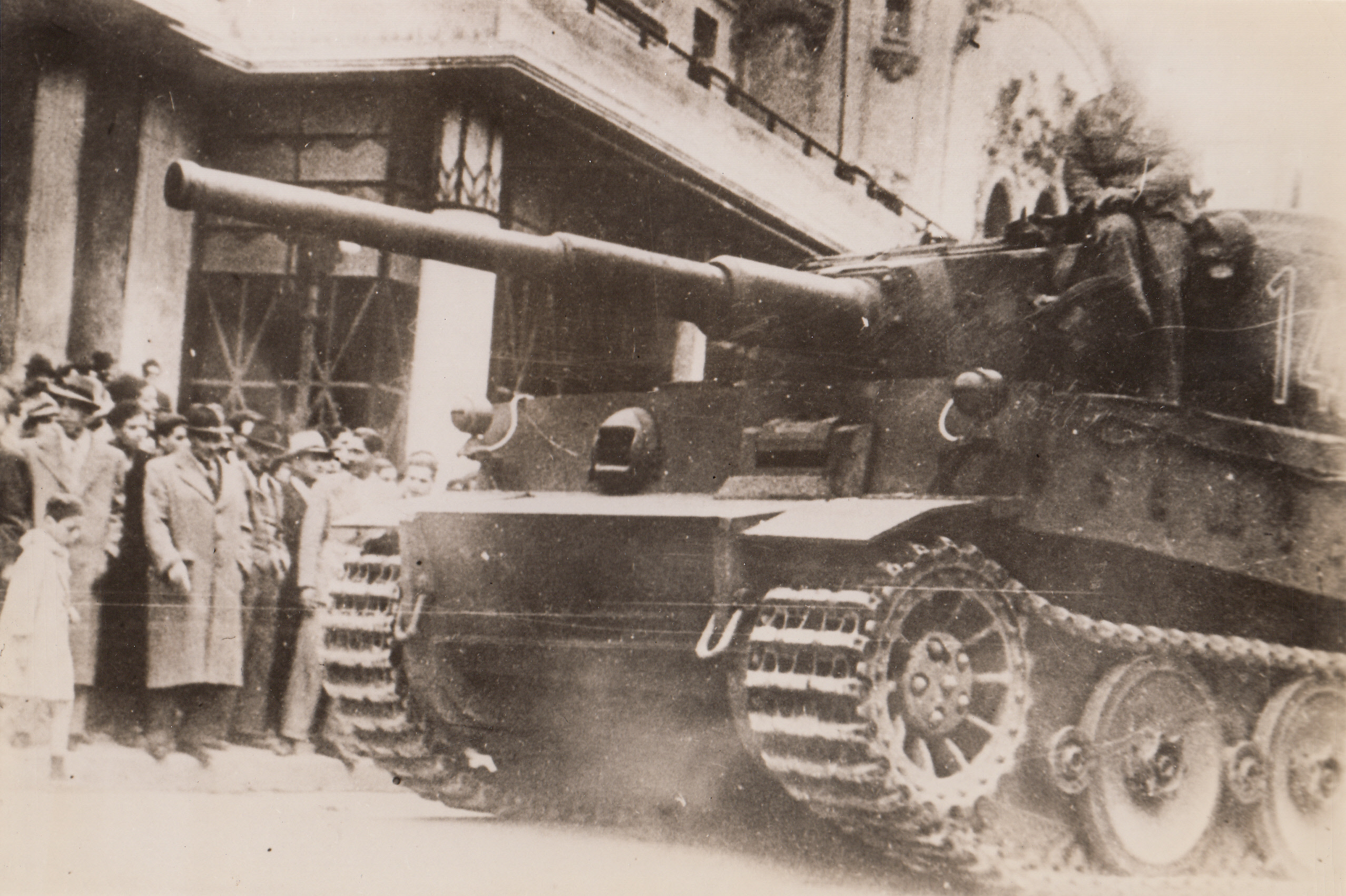 Nazi Tank in Tunis, 1/10/1943. Tunis, Tunisia – Photo, obtained through neutral sources in Portugal, shows a heavy German tank rolling through the streets of Tunis.  Latest reports show the Tunisian front indicate that French forces have repulsed a Nazi attack Northwest of Pichon, which is 85 miles Southwest of Tunis.;