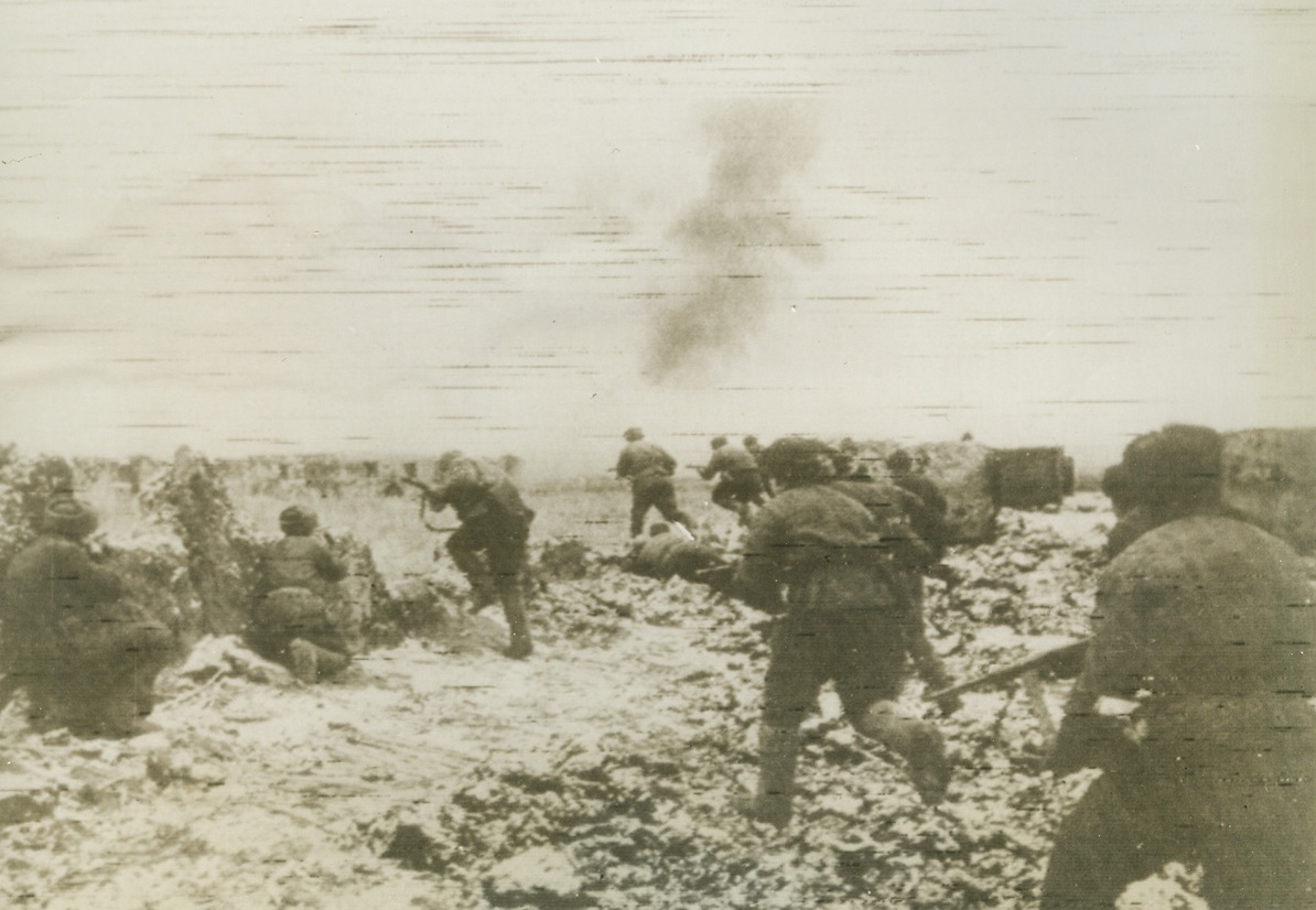 Reds Rout Nazis South of Stalingrad, 1/18/1943. Stalingrad—Under heavy fire, Red guardsmen dislodge the enemy from Formossin, south of Stalingrad. During the night, one Russian unit slew 1,000 Nazis in the Stalingrad area, capturing 850 others while in the last 48 hours 3,000 enemy soldiers are reported either killed or captured in the same territory. Credit: ACME.;