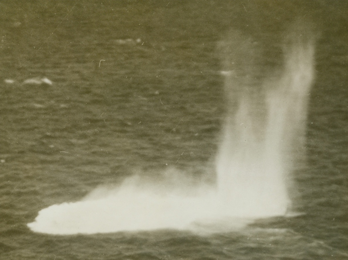 Thar’s a Sub Down Thar, 1/7/1943. Somewhere in the Atlantic – Depth charges from an RCAF Atlantic coastal patrol bomber rain down to the sea, churning the water all around the spot where the conning tower and afterdeck of a Nazi sub could be seen only a few moments before. Passed by censor. Credit: ACME;