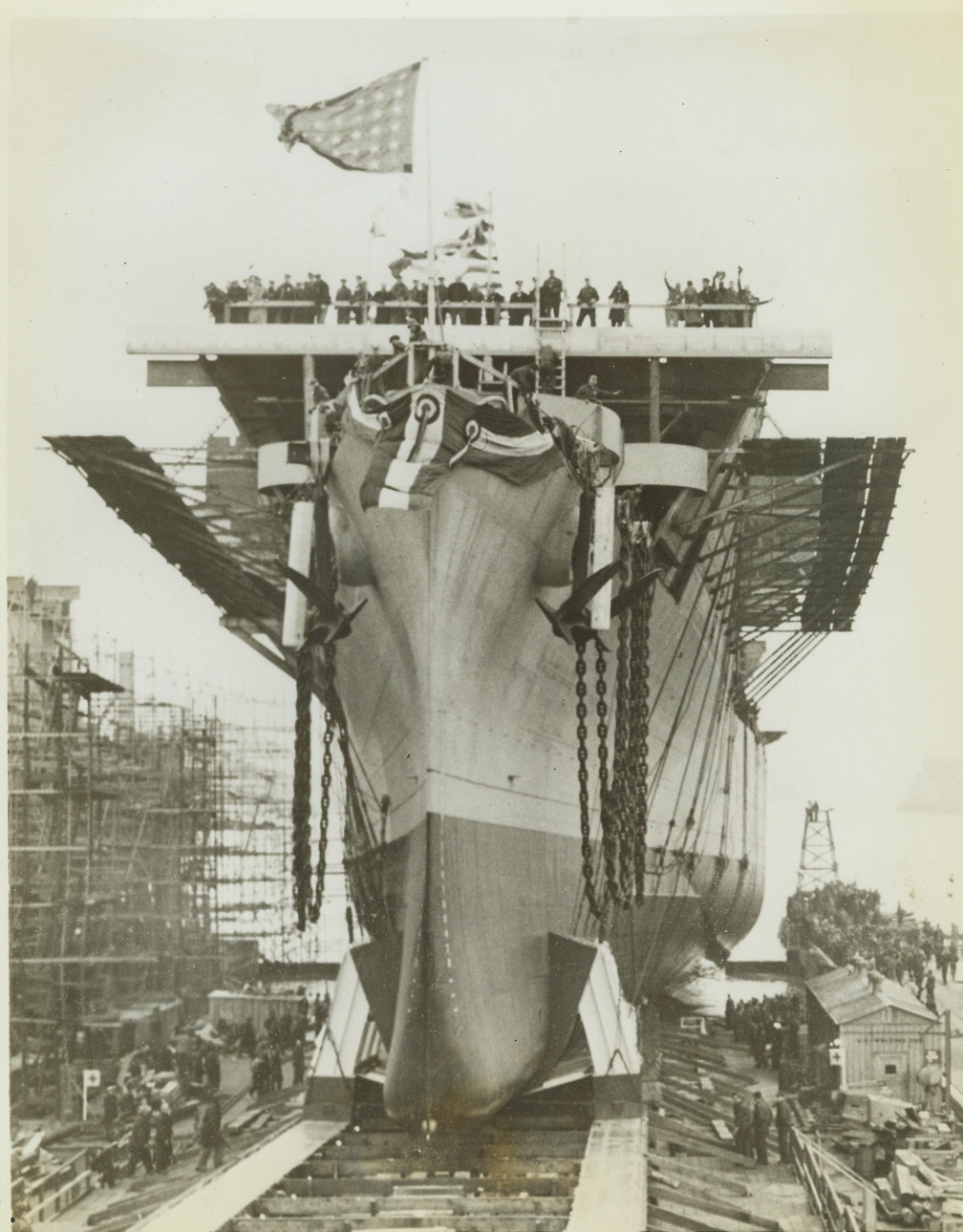 “Cowpens” Goes Down the Ways, 1/17/1943. Camden, N.J.—The U.S.S. Cowpens, an aircraft carrier named in memory of a Revolutionary War battle fought at Cowpens, S.C., goes down the ways at the New York Shipbuilding Corps Yards in Camden. Launched on Jan. 17, the Cowpens is the fourth carrier to be launched by the corporation in 20 weeks. Mrs. Preston Lea Spruance, daughter of Admiral William F. Halsey, sponsored the vessel. Credit: ACME.;