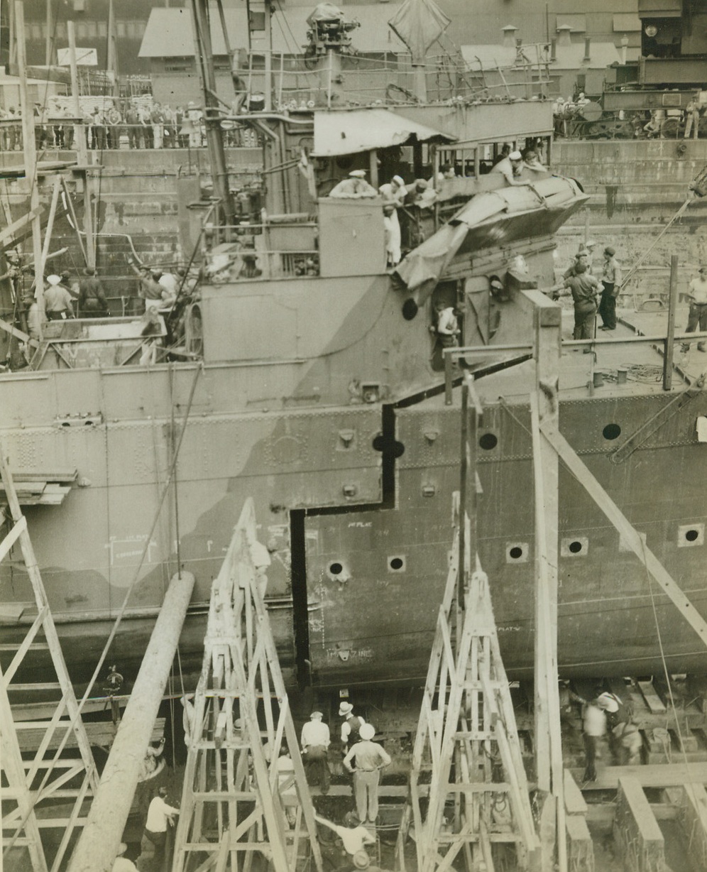 Jig-Saw Puzzle, 1/7/1943. Philadelphia, PA.—Fitting together as neatly as two parts of a jigsaw puzzle, the bow, cut from the decommissioned U.S.S. Taylor, is fitted to the U.S.S. Blakeley, her sister ship. The Blakeley, an old four-stacker destroyer, was badly damaged by an enemy torpedo last May. Grafting parts of her sister ship to the damanged destroyer, Navy workmen have turned the hardy vessel back to sea, good as new, with a greater firepower and cruising radius than she had before. Credit: Official U.S. Navy photo from ACME.;