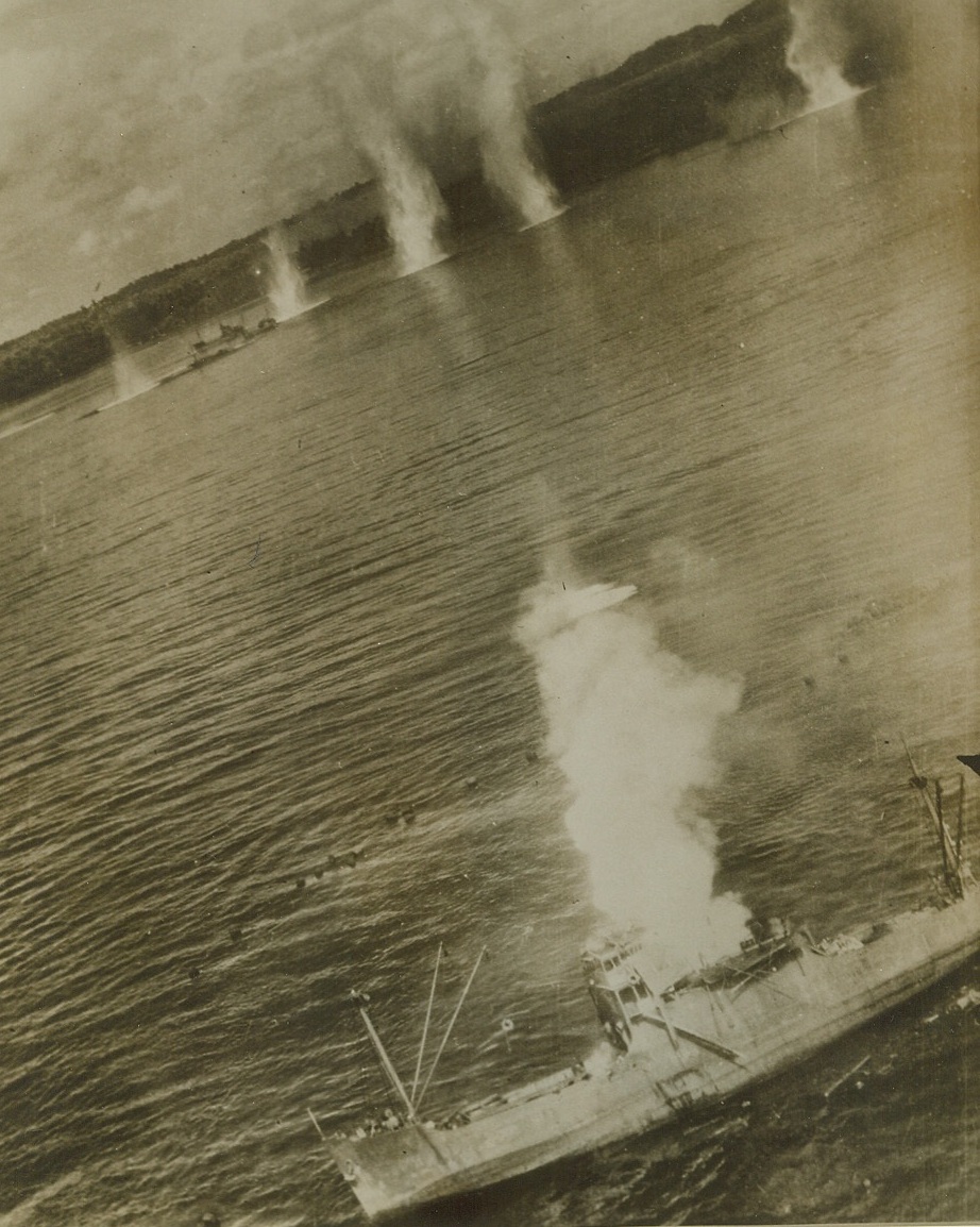 Geysers in Hansa Bay, 9/20/1943. Hansa Bay, New Guinea – Bomb-geysers erupt in Hansa Bay as bombers of the U.S.A.A.F. attach Jap cargo vessels attempting to land supplies for their troops on the North coast of New Guinea. Receiving its fifth hit, the vessel in the foreground is heeling over. Yesterday (September 19th) Mitchell bombers battered the dock area, power station and Jap headquarters at Monywa, on the Chidwin River, in Burma. Credit (U.S. Army Air Forces Photo from ACME);
