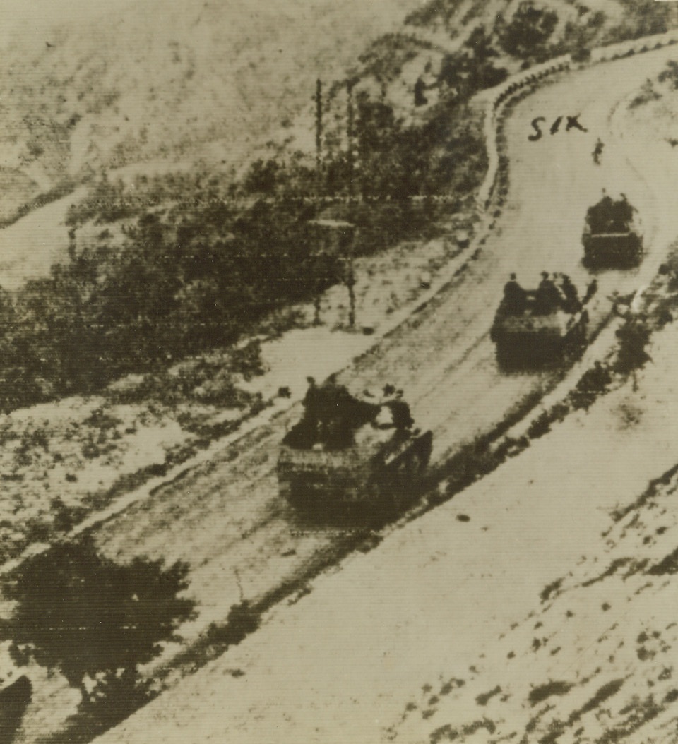 Nazi Reinforcements in Italy, 9/19/1943. ITALY—Led by a motorcycle, German motorized units roll southward over a curving north Italian mountain road, according to the German caption of this photo appearing in a Berlin newspaper. These four tanks may be on their way to reinforce northern garrisons taxed with quelling Italian resistance. Credit: ACME RADIOPHOTO.;