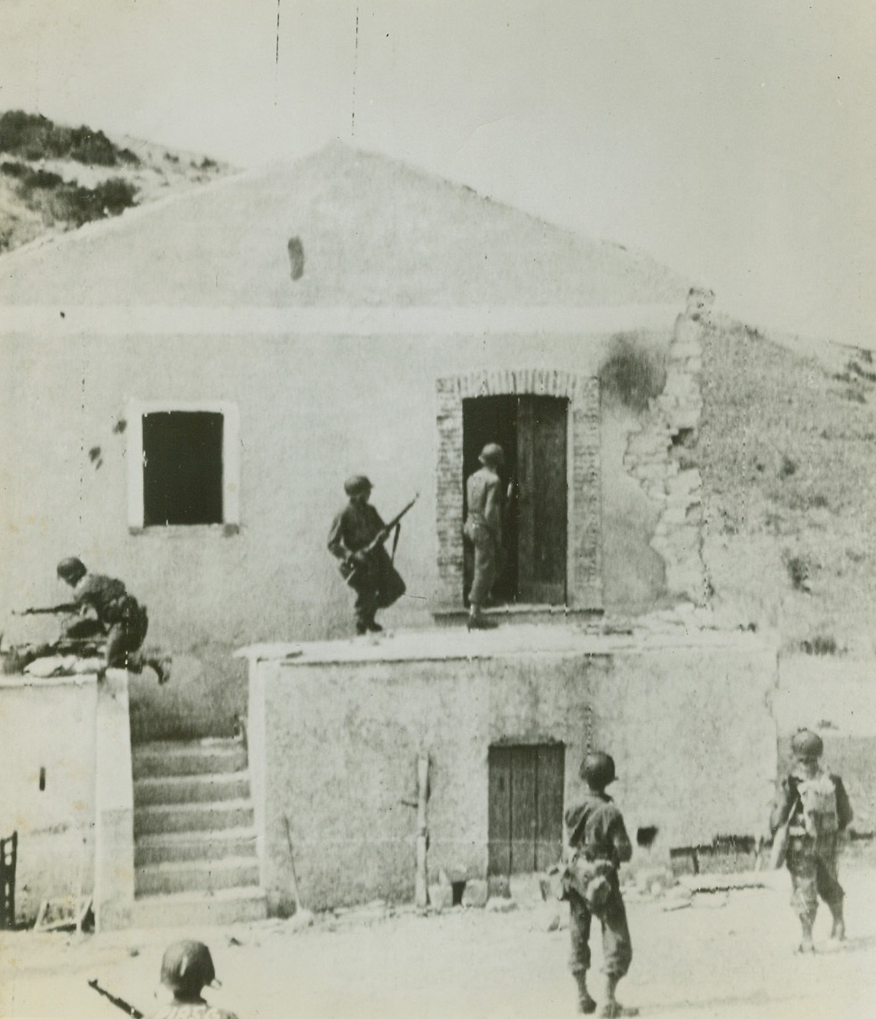 United States Troops Advance in Italy, 9/14/1943. The above photo flashed to the U S by radiotelephoto shows United States infantrymen ferreting out a German sniper who was hidden in this house during their advance through the outskirts of an Italian town.  Credit: (U S Army Signal Corps Radiotelephoto from ACME);