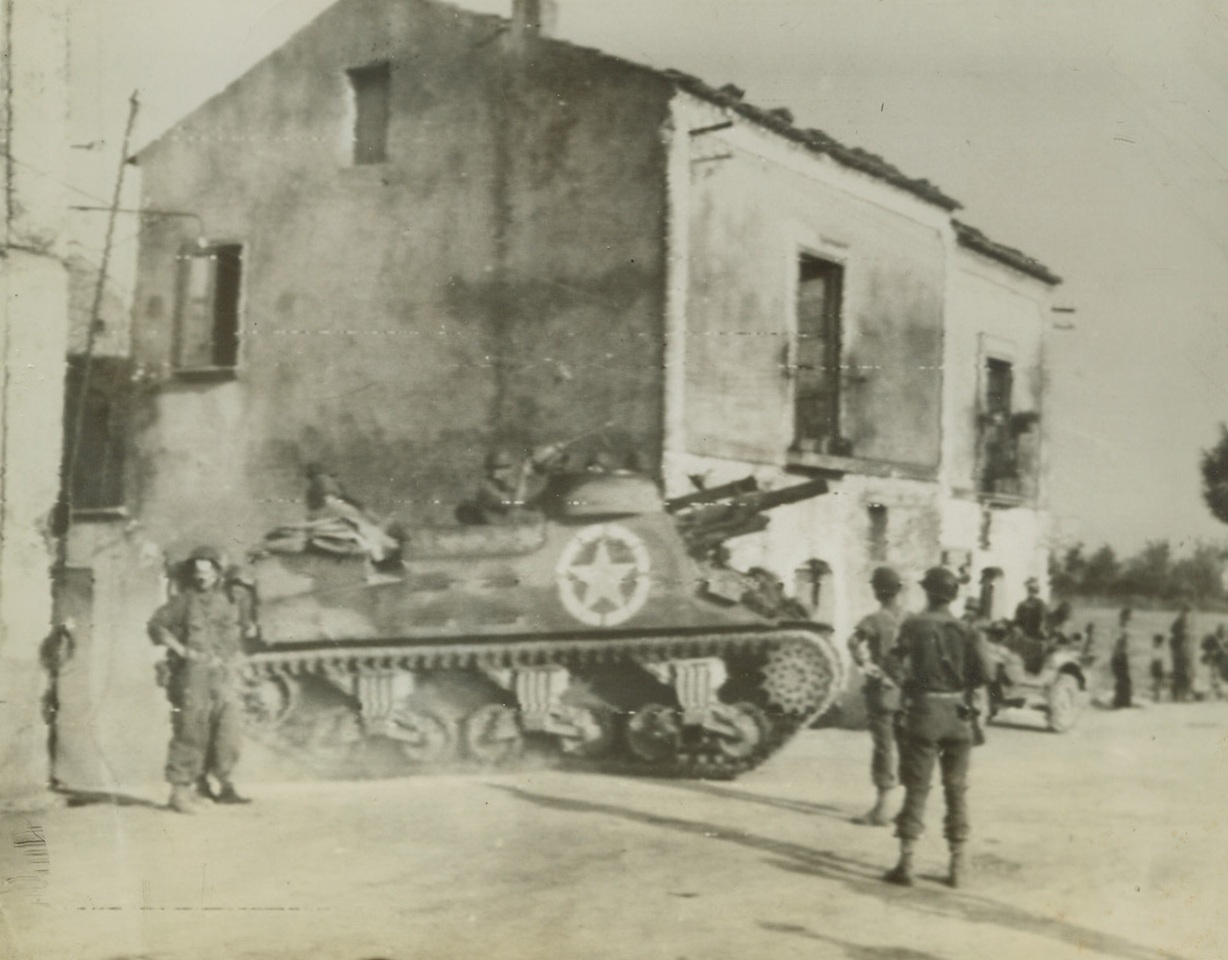 UNITED STATES TROOPS ADVANCE IN ITALY, 9/14/1943. The above photo flashed to the U S by Radiotelephoto shows an American tank destroyer entering a town in Italy on the morning of Sept. 10th after our troops had effected a landing near the town. Credit: U S Army Signal Corps Radiotelephoto from Acme;
