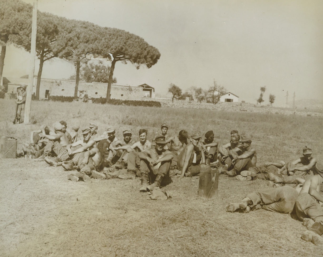 Snared Supermen, 9/25/1943. ITALY – Taken in the Salerno area, these Nazis were among the first prisoners captured by the Allies in the invasion of the Italian mainland. Squatting dejectedly, they are being guarded by the doughboy who leans against a pole in the left background. About 2000 Nazis have been taken by the Fifth Army. Credit Line – WP – (ACME);