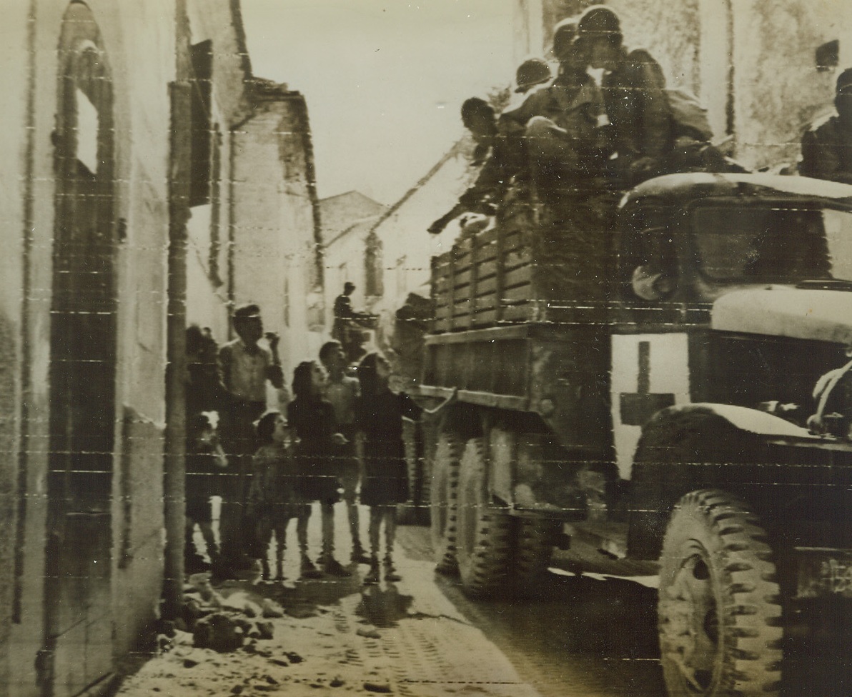 Italian Children Seek Candy, 9/29/1943. The above photo, flashed to the United States by Radiotelephoto, shows Italian children asking for candy from the soldiers aboard slow moving trucks of a medical unit passing through an Italian town. Credit Line (Off. U.S. Army Signal Corps Radiotelephoto from ACME);