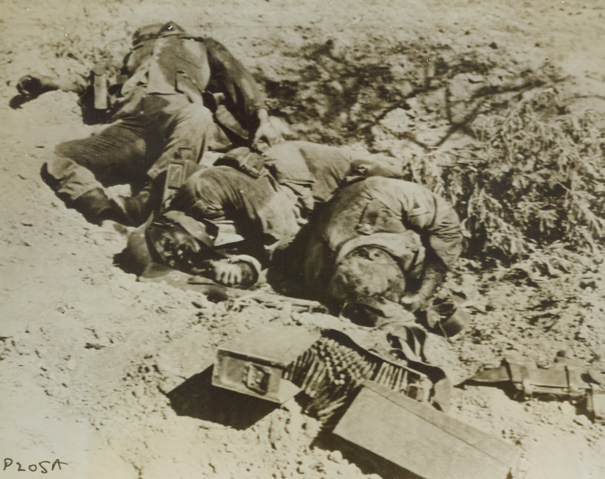 Death in a Foxhole, 9/26/1943. ALTAVILLA, ITALY – Sprawled in a dusty foxhole, these Nazis were killed as they tried to hold off advancing American troops at Altavilla. Credit (Signal Corps Radiotelephoto from Acme);