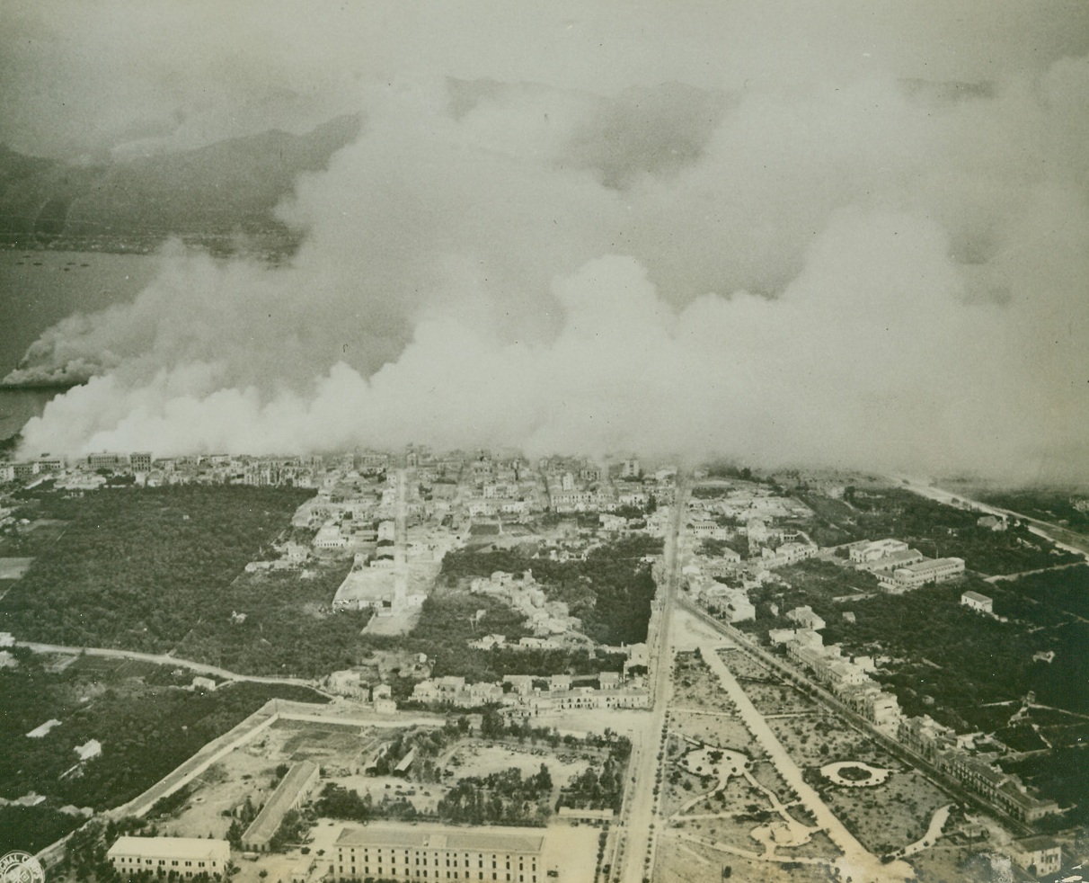 Protective Smokescreen Over Palermo (#1), 9/27/1943. PALERMO, SICILY – During a recent demonstration, the Chemical Warfare Branch of the U.S. Army Service Forces covered Palermo with a protective smokescreen. Here, clouds of smoke start streaming over the city from many points. Credit Line (U.S. Signal Corps Photo from Acme);