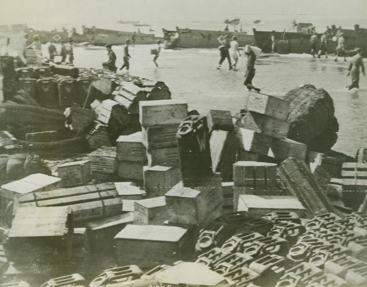 Landing Supplies on Italy’s Shore, 9/13/1943. The above photo flashed to the United States by Radiotelephoto shows – the quick unloading of supplies to keep pace with the fast moving United States troops as they invaded Italy. Under constant strafing and bombing by German planes this important job was extremely hazardous. Credit Line (Acme Photo via US Army Signal Corps Radiotelephoto);