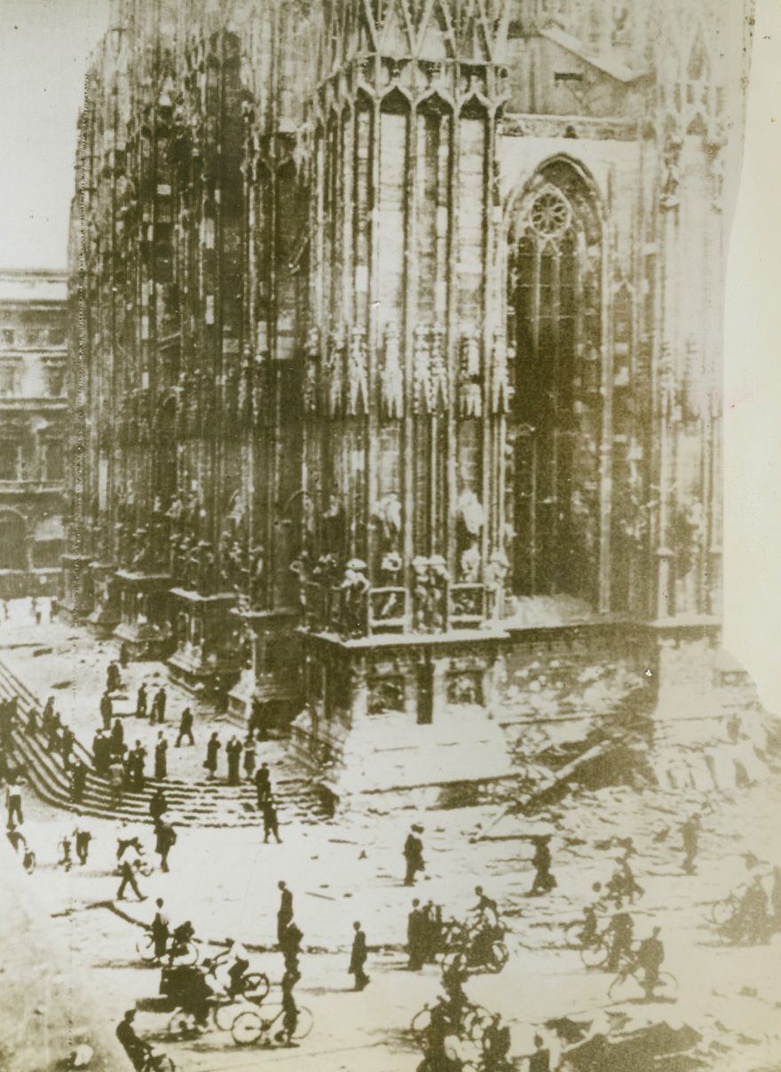Milan Cathedral Still Stands, 9/10/1943. MILAN – The famous Milan Cathedral, although close to the oft-bombed railroad marshalling yards, suffered only slight damage to one of its steeples and sides as a result of powerful allied air raids before Italy capitulated.Credit Line (Acme) WP;