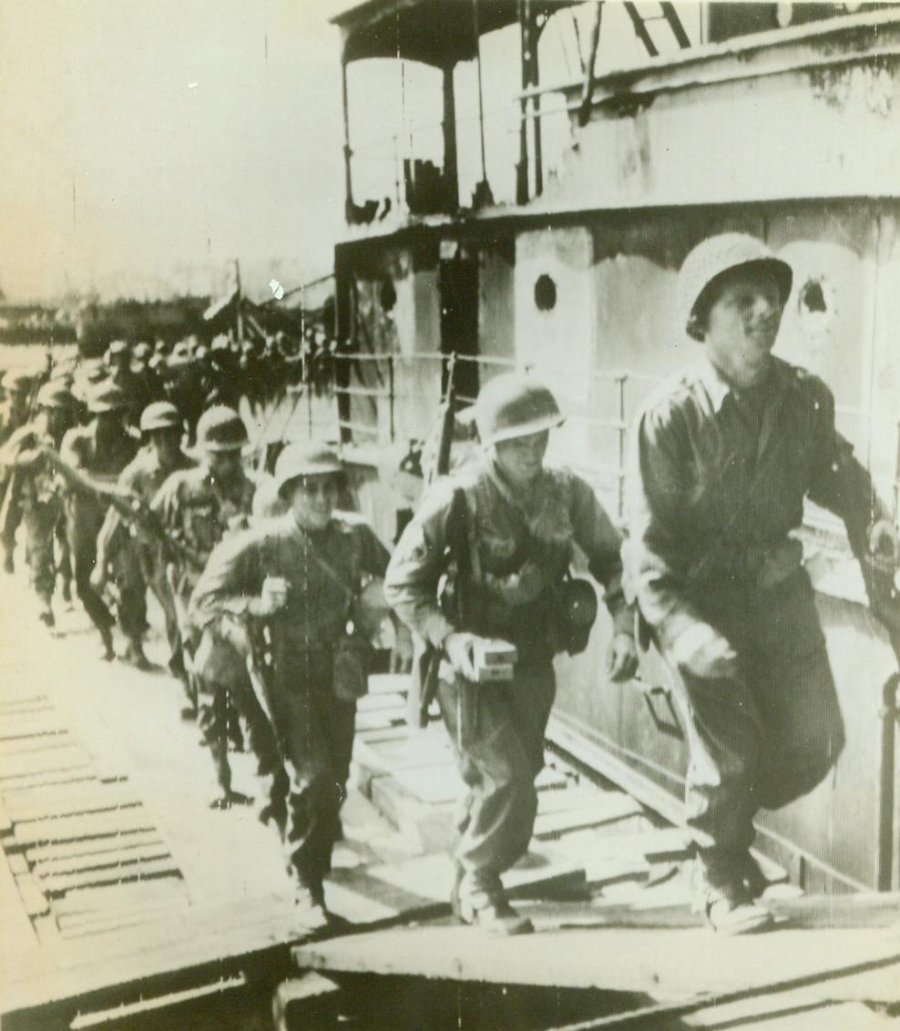 Rangers Embark For Italy Invasion, 9/10/1943. The above photo flashed to the United States by Radiophoto shows United States Rangers as they embarked at a Sicilian Port bound for their operations against the Italian Mainland CREDIT LINE (ACME Photo Via U.S. Army Signal Corps Radiotelephoto) 9/10/43;