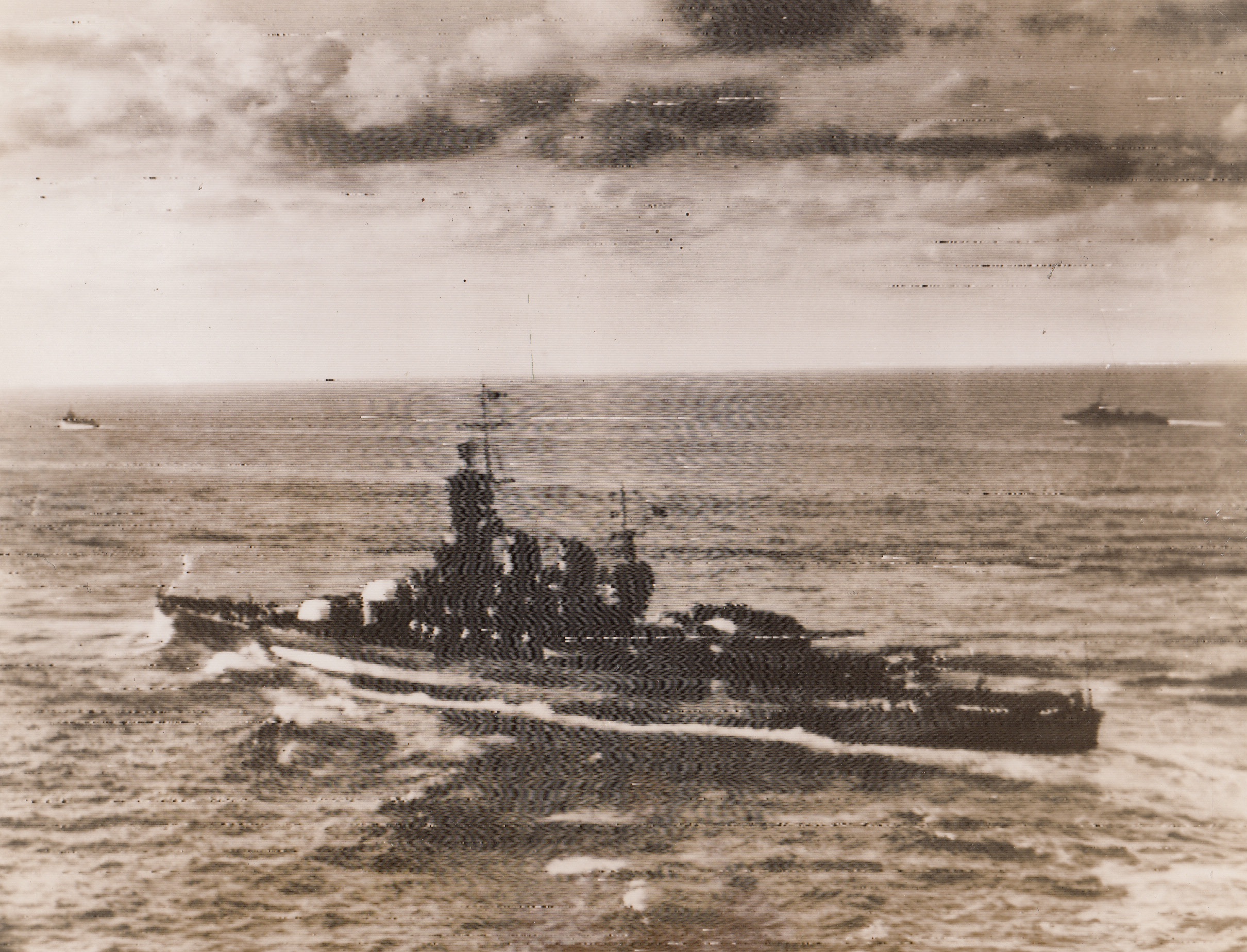 Italian R Craft Reach Allied Port, 9/18/1943. An Italian battleship (foreground) of the Littoria class, and two destroyers of Italy’s Navy, reach an Allied port in the Eastern Mediterranean, escorted by units of the Royal navy. An effective RAF umbrella protected the sea lanes from the air.  9/18/43 Credit (ACME RadioPhoto);
