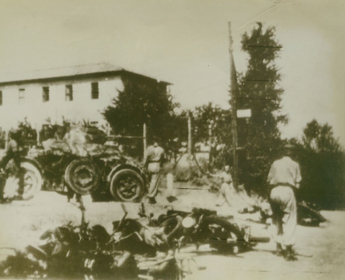 NAZI PARATROOPS LAND IN ROME, 9/16/1943. ROME—Landing in the suburbs of Rome with motorcycles, German parachute troops capture an Italian armored car, according to the German caption that accompanied this radiophoto. Radioed from Berlin to Stockhold, photo was radioed to New York today (September 16th). Credit: Acme radiophoto;