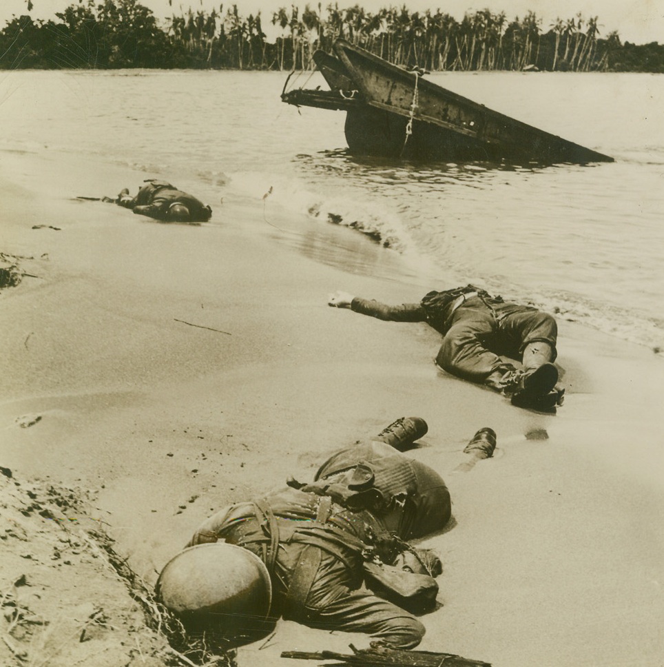 OURS, 9/13/1943. NEW GUINEA—Japs, hiding in a barge with rifles and grenades, took the lives of these three American fighters who were mapping up on the last day of the Buna Gona battle in New Guinea, last January. Beach and barge action was the bloodiest and most fierce of any Buna action, and these boys are among those who lost their lives but helped win the battle. Credit: Acme;