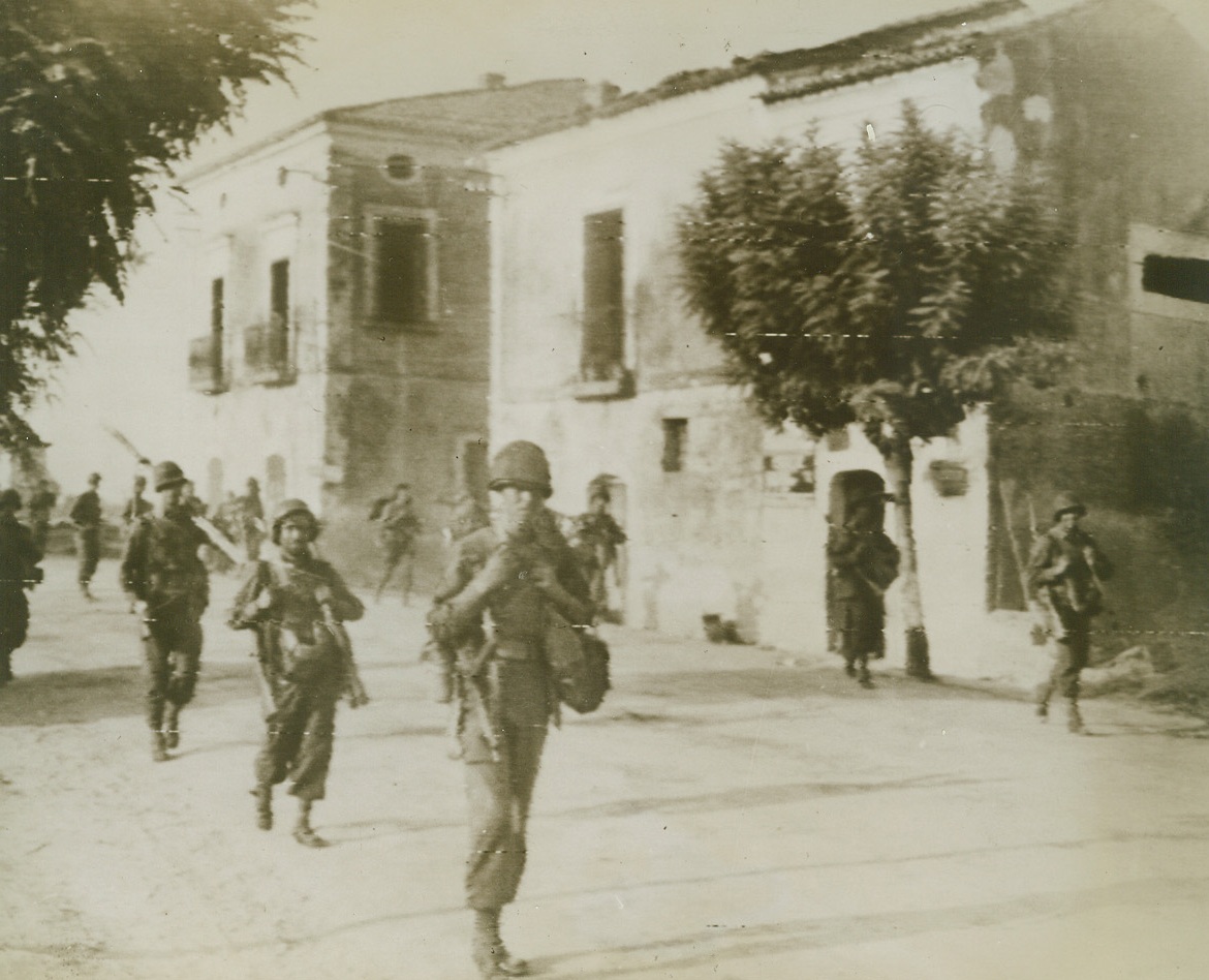 On The March In Italy, 9/14/1943. Italy – Shortly after they landed at an adjacent beach, U.S. Infantrymen march through a seacost town in Italy. The Nazi propaganda machine has it that we are abandoning our beachheads in Salerno, but the report is only enemy wishful thinking 9/14/43 Credit (U.S. Army Signal Corps Radiotelephoto From ACME);