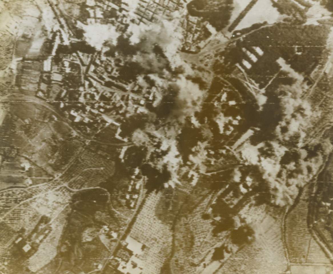 Smoking Out the Nazis, 9/12/1943. Italy – Bomb bursts blanket the town of Frascati, Italy, as Flying Fortresses of the Northwest African Air Forces destroy the German military headquarters located there. The furious September 8 raid followed the capitulation of Italy. Credit: AAF photo by Signal Corps Radiotelephoto from ACME;