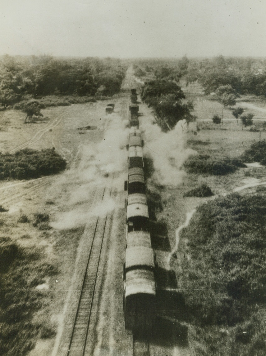 RAF Blasts Jap Freight in Burma, 9/10/1943. Burma – Freight cars, carrying cotton and ground nuts which are vital Japanese war materials, between Monywa and Sagaing, are blasted by raiding RAF Beaufighters.  Striking with cannon and machine guns, the Beaufighters were detailed to attack this important Burmese railway line.Credit Line (ACME);