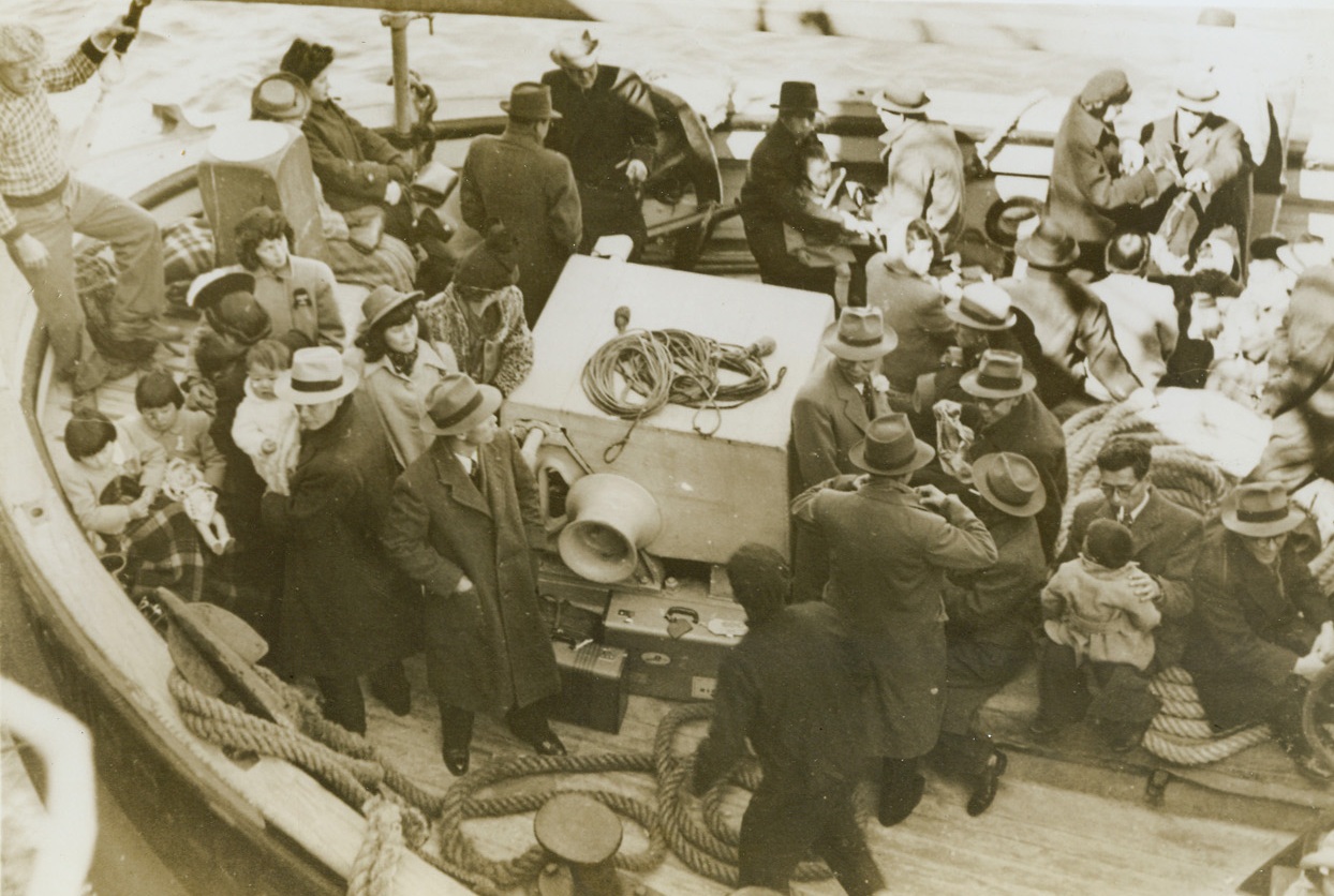 Exchange-Ites, 9/29/1943. Montevideo, Uruguay—Japanese diplomats and business men, and their families, shown on the tug “Antonio Lussich” in Montevideo Harbor, to be transferred to the Swedish Liner Gripsholm for shipment to Porto de Goa; Portuguese possession. There they will be exchange for a group of Chileans who were interned by Nazi authorities in Germany.Credit: ACME.;