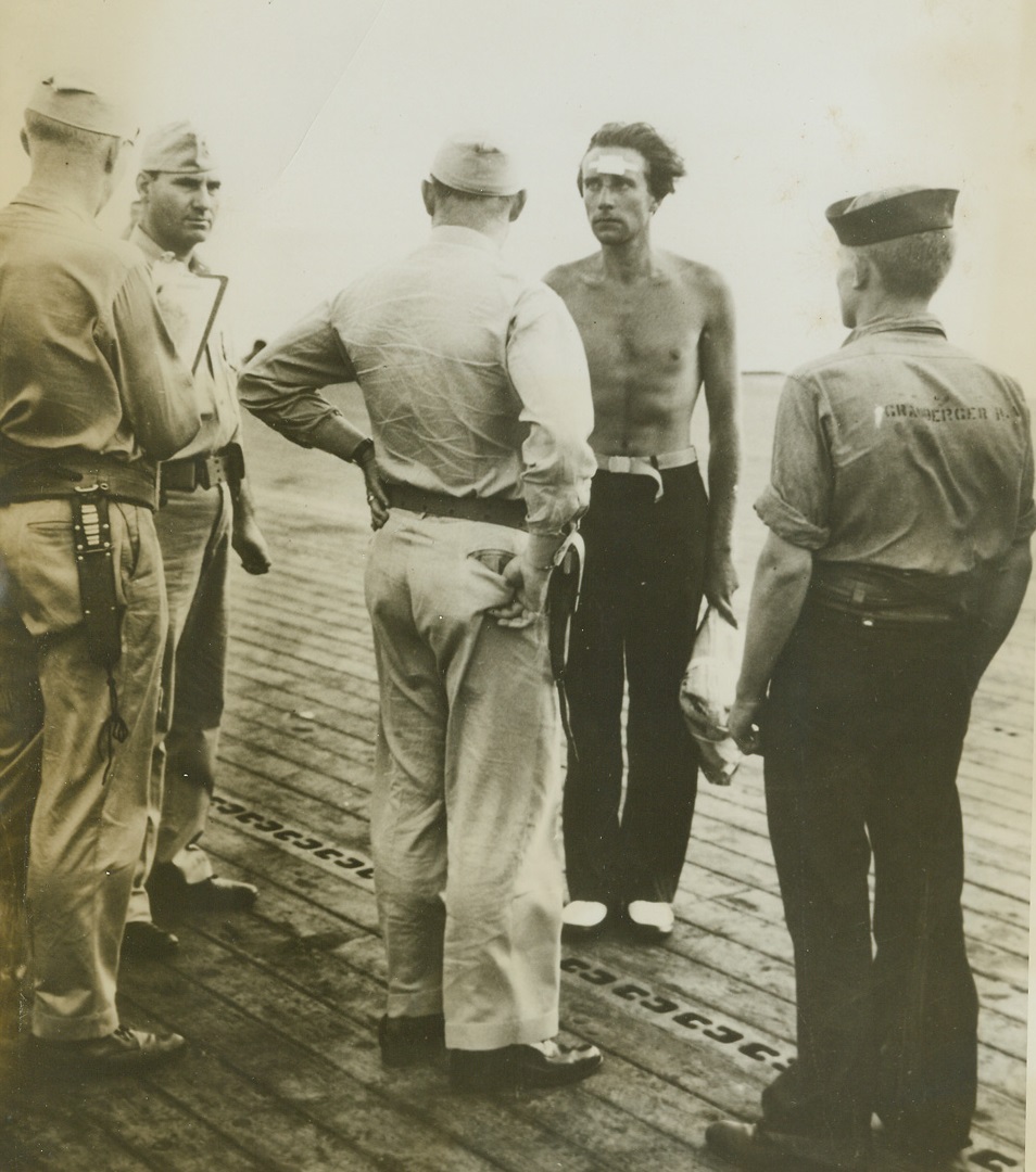 U.S. Navy Plane Downs 3 Nazi Subs, 9/28/1943. WASHINGTON, D.C. - One, lone U.S. Navy Grumman Avenger (TBF) Torpedo Bomber flying from an escort carrier in the Atlantic, has made history by definitely sinking 3 Nazi U-Boats in 4 days and damaging another, according to announcement in Washington today. Lt. Robert P. Williams, USNR, and his two-man crew not only escaped unscathed in the attacks, but produced excellent pictorial evidence of the "kills". Here, after being rescued along with some 30 members of his crew, the commanding officer, (without shirt, facing camera), of one of the U-Boats blasted by Lt. Williams and his gallant crew, chats with officers of the escort carrier to which he had been transferred after his rescue by a destroyer.;