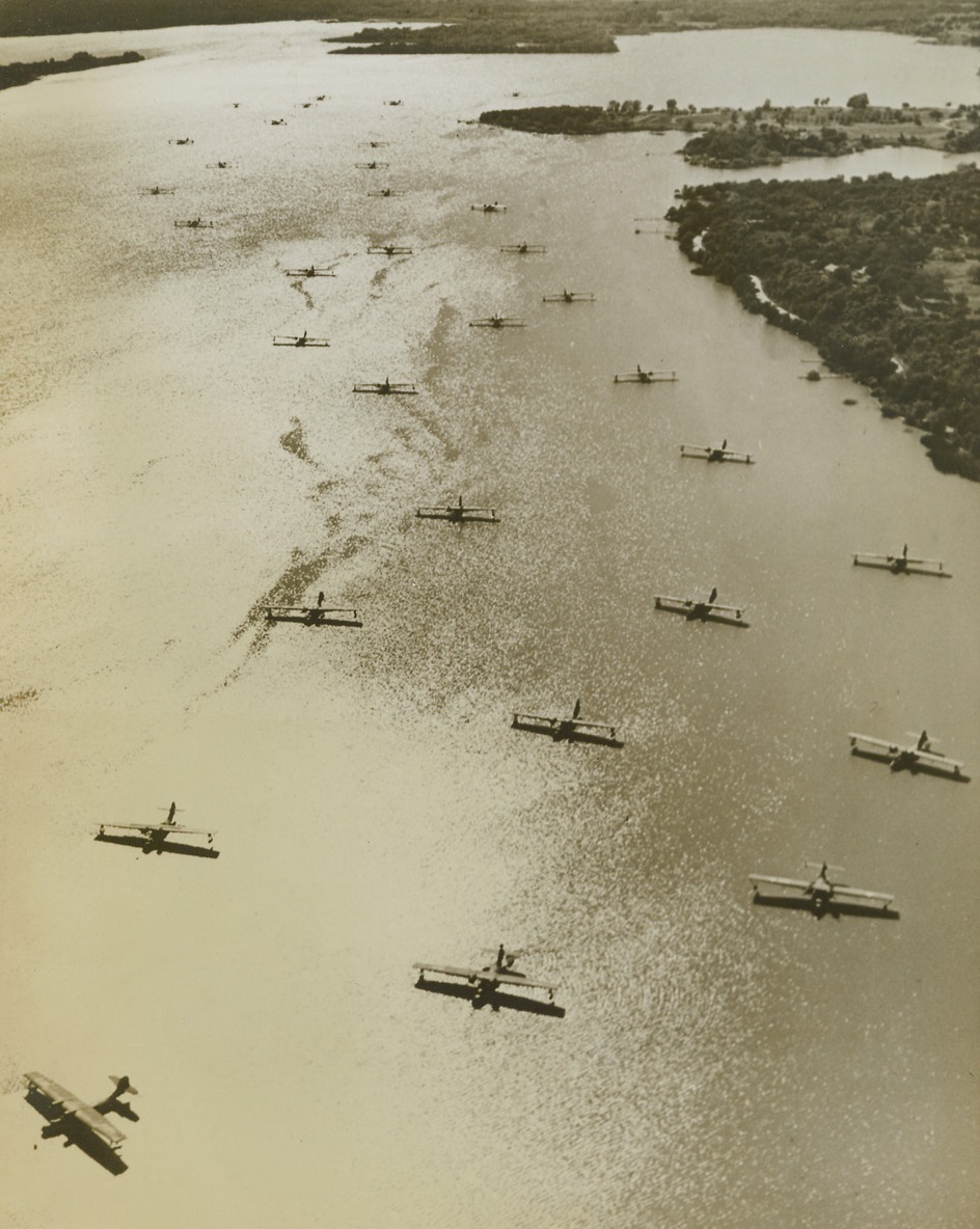 Storm Brewing, 9/28/1943. Fort Worth, Texas – More than thirty Navy PBY Catalina Flying Boats seek refuge from a threatening Gulf Coast storm, landing near Consolidated Vultee’s Fort Worth Plant which turns out Liberator Bombers and Liberator Express Transports. These planes, which appear to be resting on a sheet of silver, are known as the “workhorses” of the Navy. 9/28/43 Credit Line (ACME);