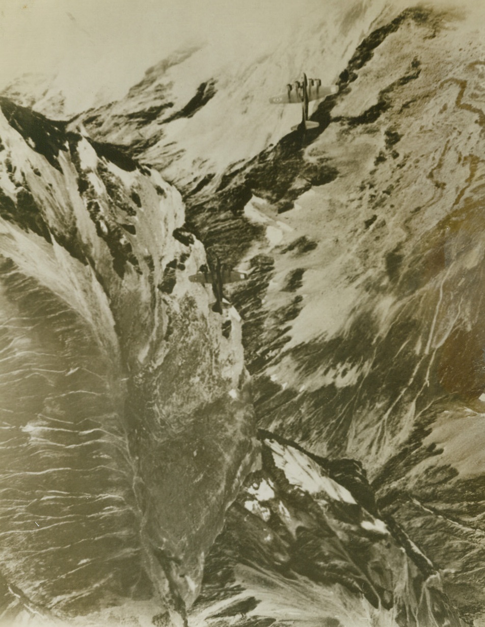 U.S. Bombers Over Alps On Shuttle Trip, 9/22/1943. Flying Fortresses of the U.S. 8th Air Force based in England, pass over 12,000-foot peaks of the Alps, on their first shuttle bombing trip from England to North Africa and return. Shortly before this photo was taken, the Bombers blasted the Messerschmitt Plane Factory at Regensburg, Germany. Credit: U.S. Army Air Forces photo from ACME;