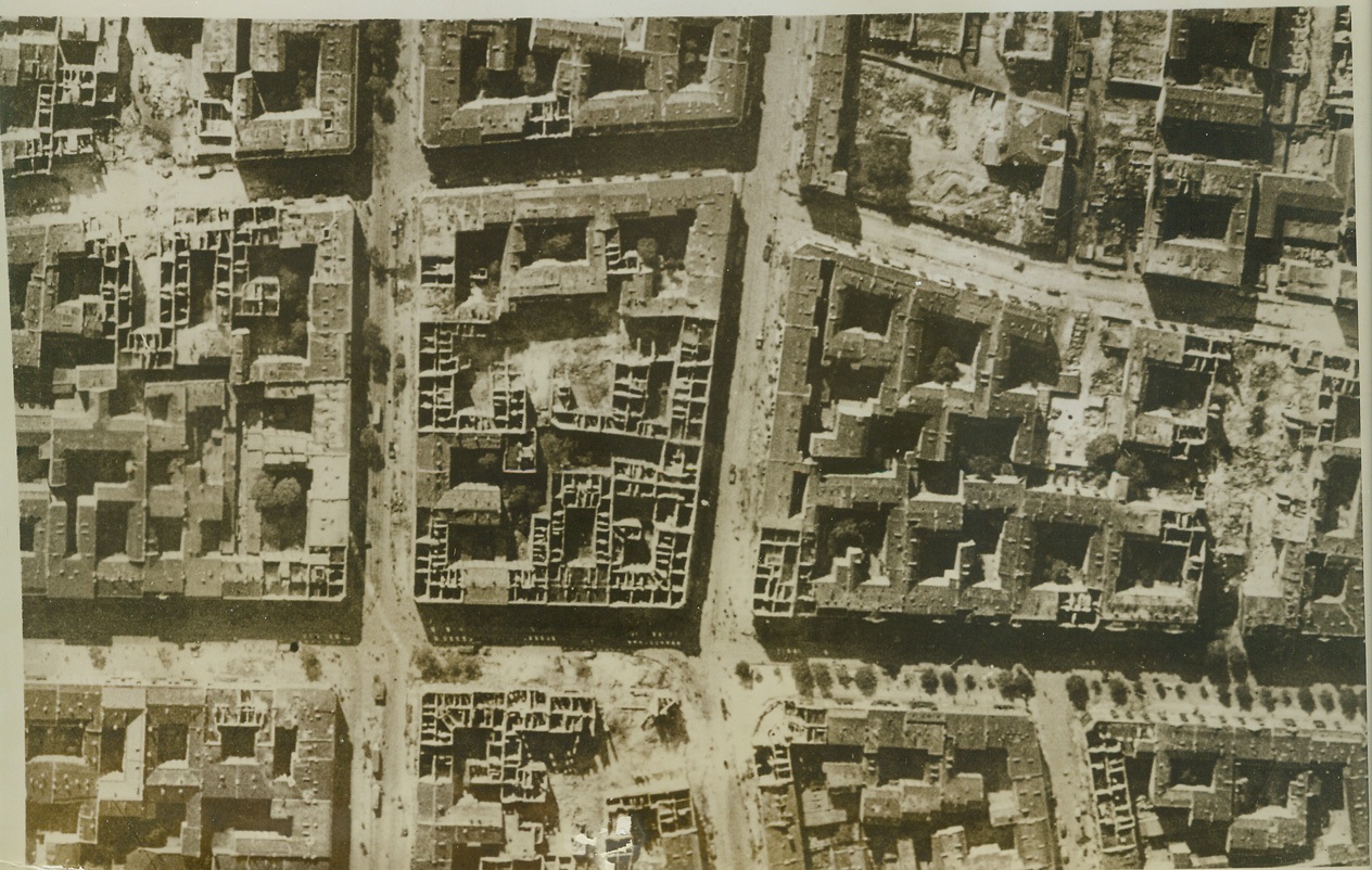 RAF Bombers Hit Berlin, 10/14/1943. Her industrial centers heavily hit during raids by the RAF Bomber Command, Berlin has suffered considerably from Allied air attack. This aerial view of the Moabit District, northwest of Tiergarten, shows how badly buildings in the area have been hit. Points where heavy bombs exploded with devastating effect can be clearly seen.  Credit: (ACME);