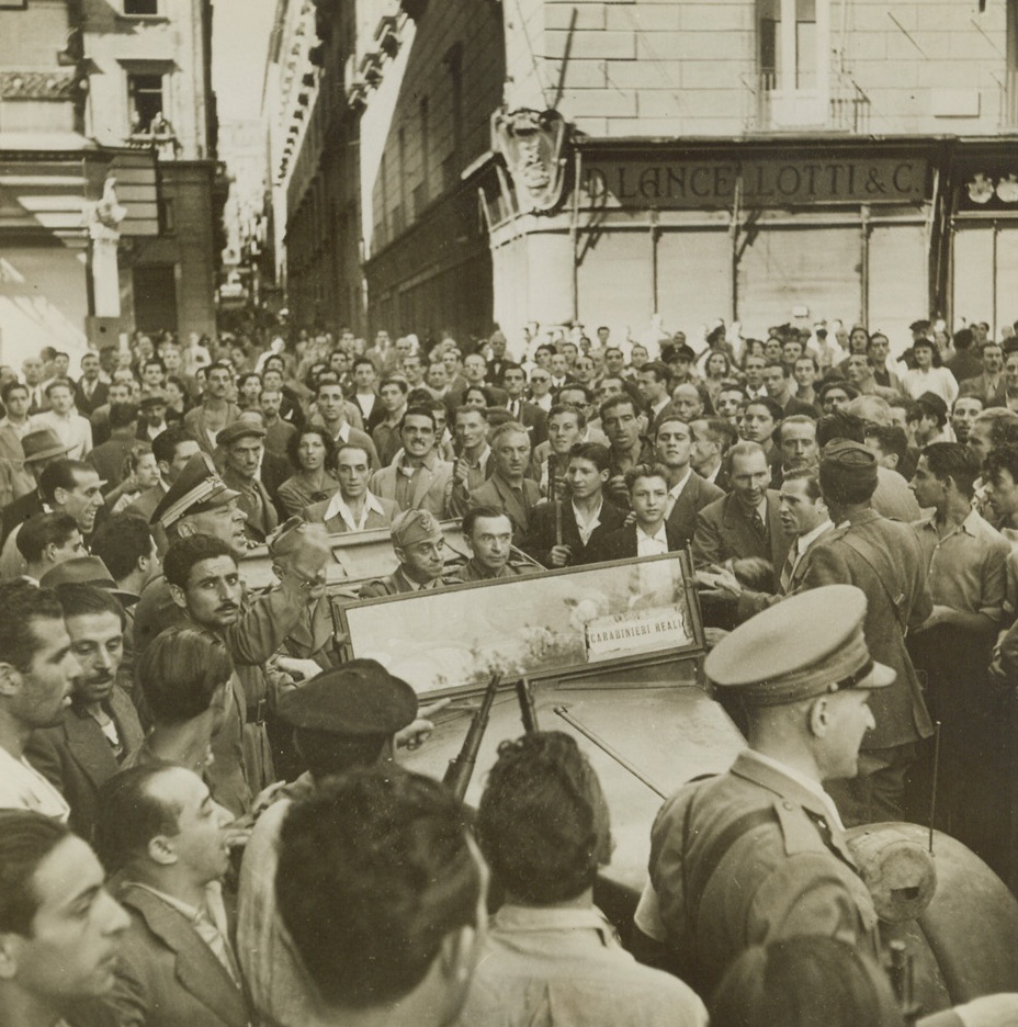 The Jig’s Up, 10/11/1943. NAPLES, ITALY—Three cringing fascist generals are faced with a revengeful mob who are out to kill them for the part they played in helping the Germans defend Naples against the Allies. The Generals—Radice, Carlino, Salla—are rescued by the Carabinieri and removed into the Municipio with great difficulty in this scene which represents the first open revolt of the people against their fascist leaders since our invasion of Sicily. The three Italian Generals were in charge of the defense of Naples.  Credit: line (ACME);