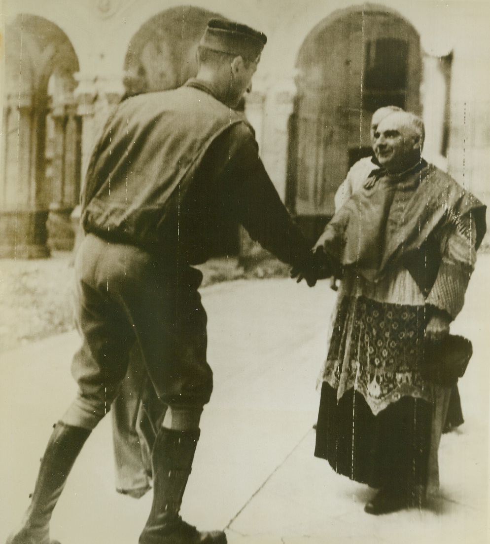 Gen. Clark Greets Bishop of Naples, 10/15/1943. This photo, flashed to the U.S. by Radiotelephoto, shows Lt. Gen. Mark W. Clark (left), Commanding General of the 5th Army, as he greeted the Bishop of Naples, before the Cathedral, where the General attended Mass. Credit Line (ACME Photo via U.S. Signal Corps Radiotelephoto);