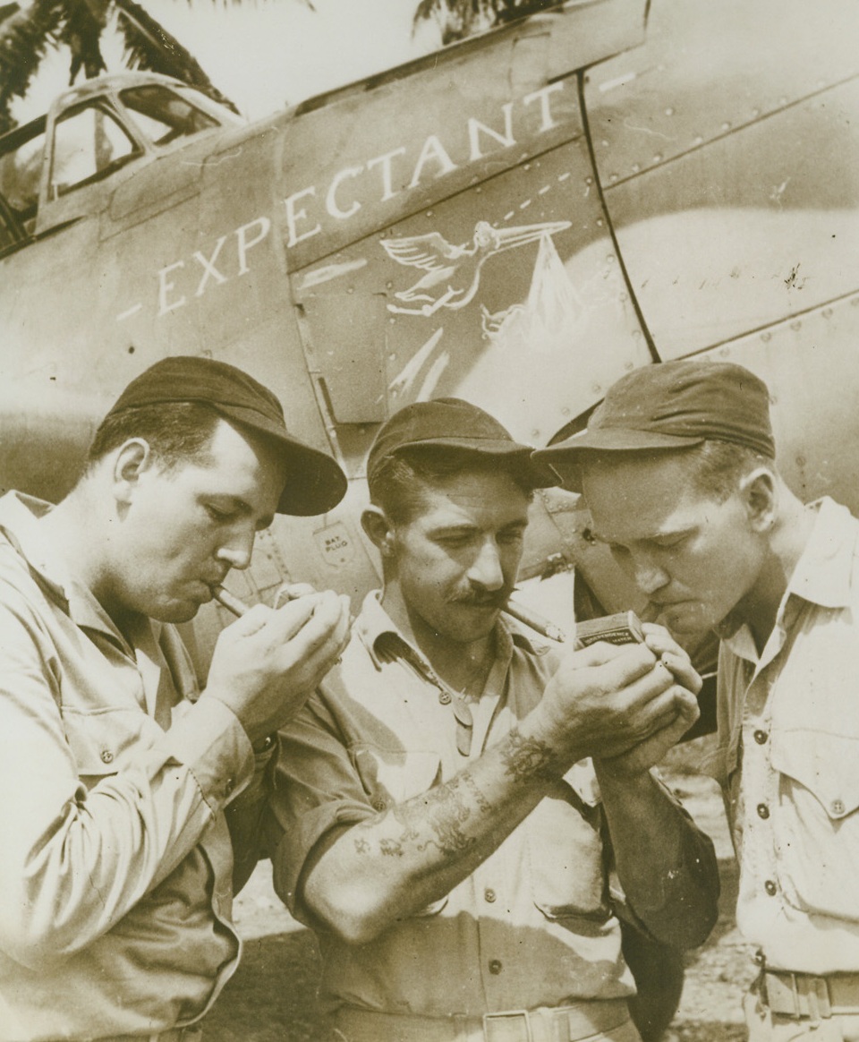 THESE “AVENGERS” ARE “EXPECTANT”, 10/25/1943. GUADALCANAL, S.I.—This Grumman “Avenger” torpedo bomber is named “Expectant” because the members of its three-man crew expect to be fathers before the end of the eyar. The fathers-to-be are (left to right) Marine Maj. Rolland F. Smith, Laguna Beach, Calif.; Sgt. Jack N. Stanner, radioman and gunner, Niles, Mich.; and Sgt. Irwin F. Waldvogel, turret gunner, of Cicero, Ill. Credit: Official Marine Corps photo from Acme;