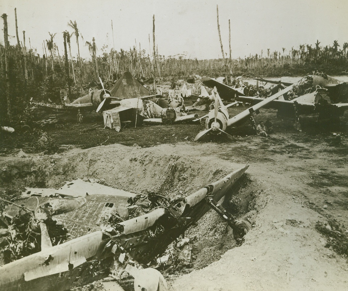 BONEYARD FOR JAP WARBIRDS, 10/9/1943. MUNDA—Wrecked Japanese planes, destroyed during the Allied battle for Munda, stretch across this war-torn field. The enemy warbirds were assembled for study by Marine aviation intelligence officers. Credit Line (Official U.S. Navy Photo from ACME);