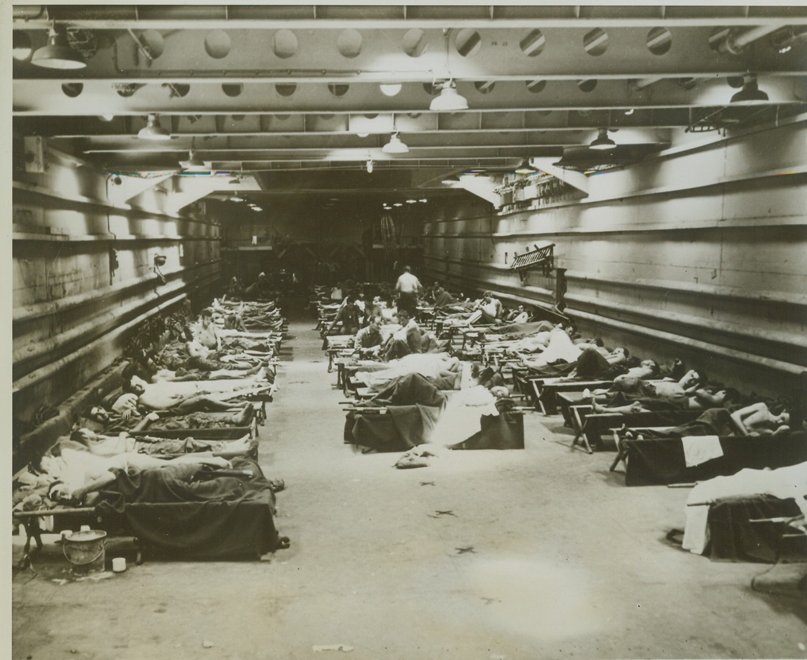 "Green Dragons" Become Hospital Ships, 10/21/1943. SOUTH PACIFIC -- This LST (Landing Ship Tanks), commonly called a "Green Dragon" because of its color and size, has been pressed into action as  a hospital ship in the South Pacific carrying wounded from combat areas to base hospitals. These ships are seldom idle, for, on the trip to combat areas they carry men, supplies and equipment, and on the return trip they carry wounded. Credit: (U.S. Marine Corps Photo form ACME);