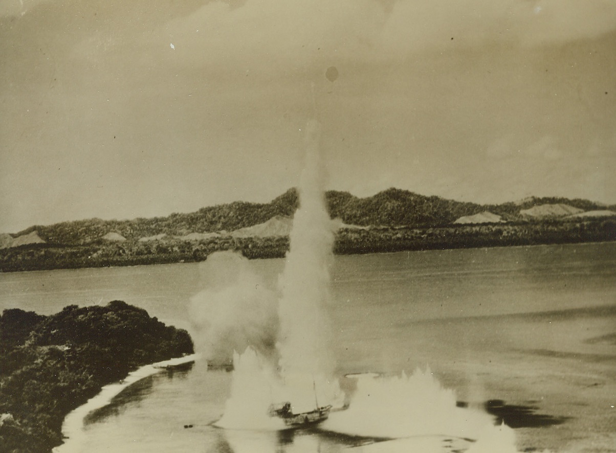 Finger of Doom, 10/14/1943. Hansa Bay, New Guinea – Like a finger of doom, a giant geyser rises alongside a small Jap boat in Hansa Bay, on the North Coast of New Guinea. Bombs from the planes of the U.S. Fifth Air Force were responsible for this and other bursts seen in photo. At least 45 barges and other small boats were destroyed by attacking USAAF planes. Credit: U.S. Army Air Forces photo from ACME;