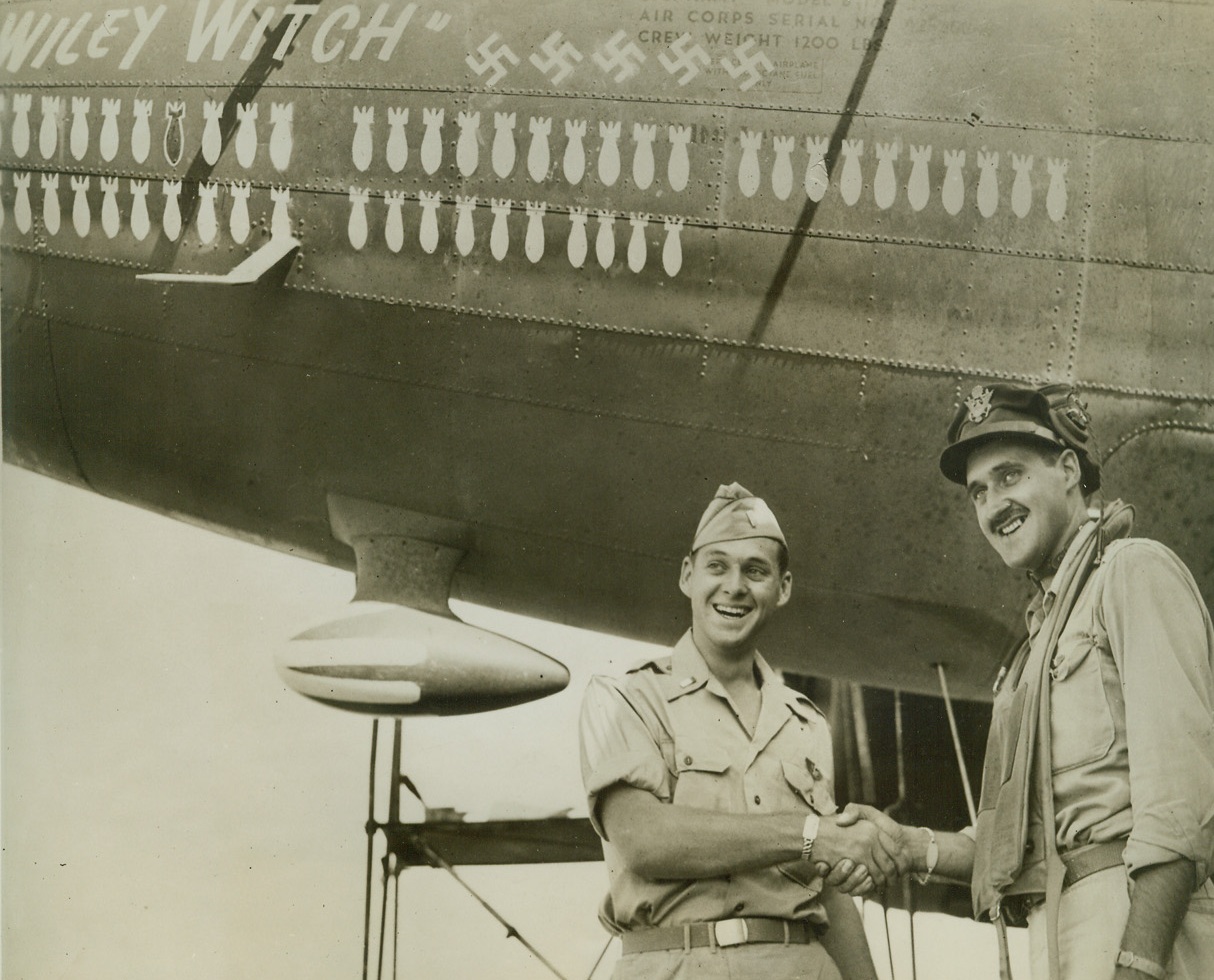 Well, Fancy Meeting You Here!, 10/20/1943. Somewhere in North Africa—Lt. James G. Johnson (left) and Maj. Roscoe H. Johnson, Jr., both Chicagoans, for two months have been piloting bombers from airports just ten miles apart in North Africa and had even participated in the same missions but neither was aware of the other’s presence until they met accidentally and had this picture made to send to their father who is a Major in the Illinois Reserve Militia. Credit: ACME.;